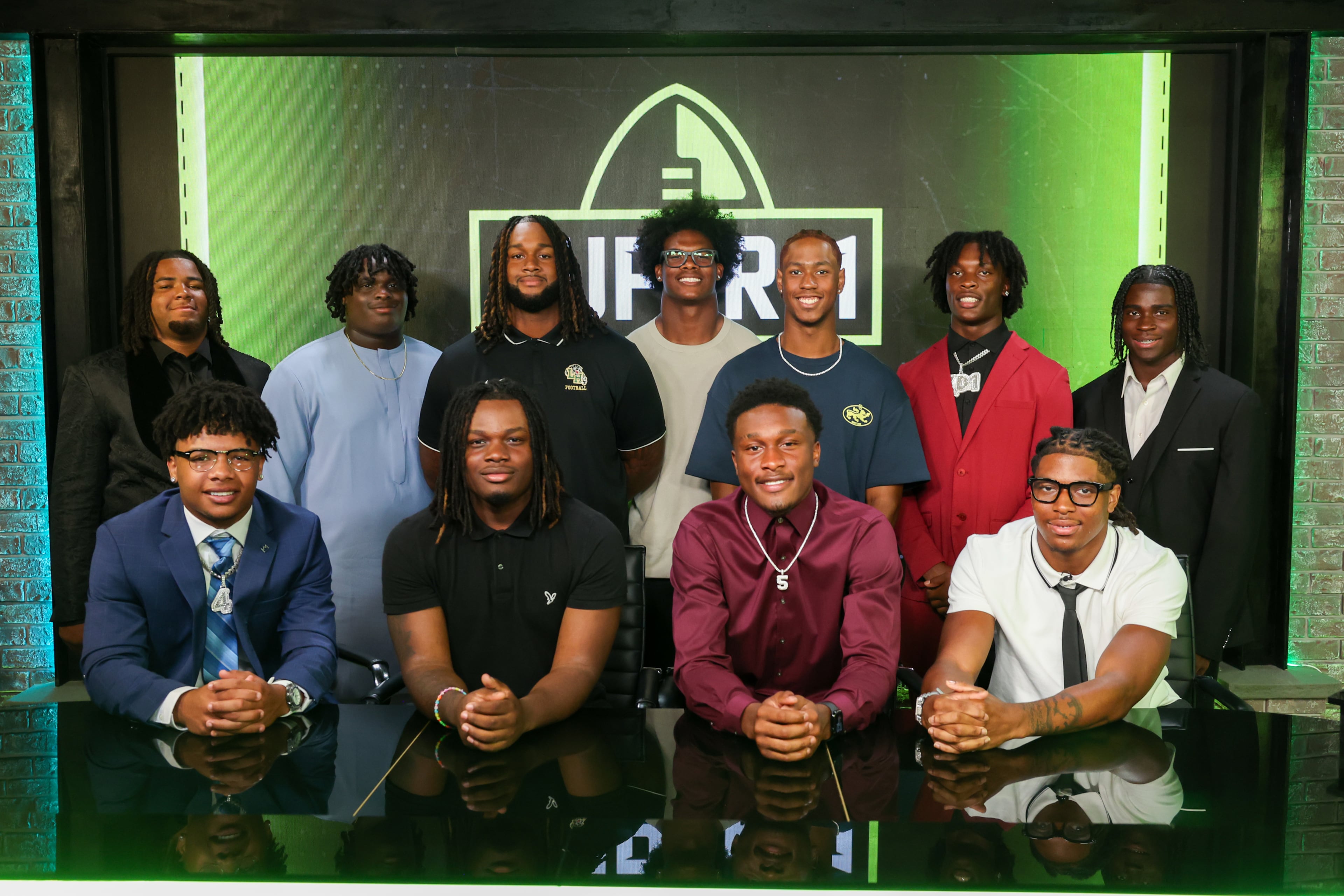 The Super 11 Class of 2026 pose for a portrait at the Super 11 reveal show at Score ATL in Roswell on Aug. 3, 2026. (Arvin Temkar/AJC)