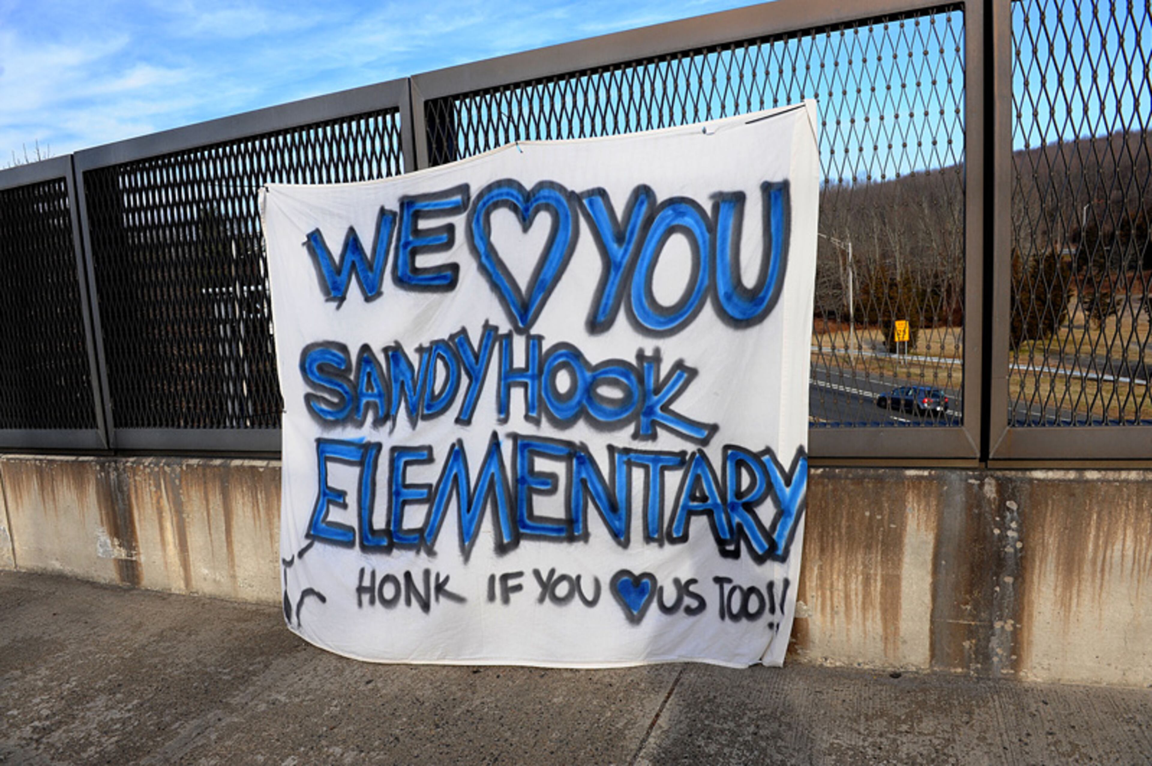 A sign in support of Sandy Hook Elementary School in Newtown, Connecticut, is shown on Saturday, December 15, 2012, a day after a shooting where 26 people died.