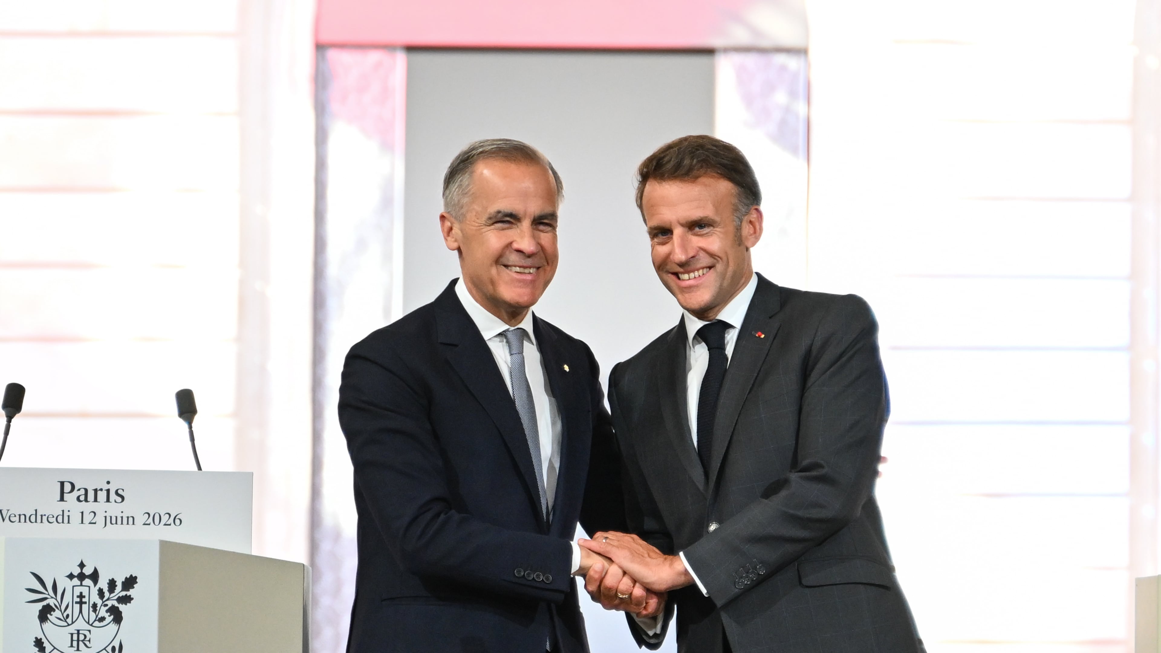 French President Emmanuel Macron, right, and Canada's Prime Minister Mark Carney at the Palais de l'Elysee in Paris, Friday June 12, 2026. (AP Photo/Emma Da Silva, Pool)