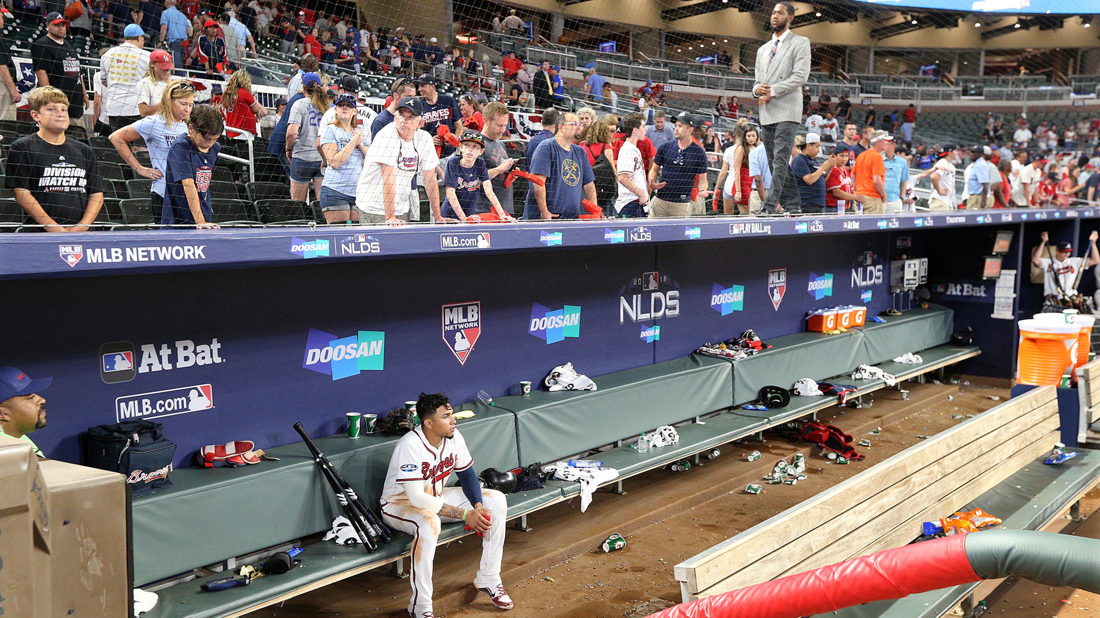 The last to leave the field Monday night, Braves infielder Johan Camargo sits in the dugout alone, contemplating the sudden end of the season. (Curtis Compton/Atlanta Journal-Constitution/TNS)