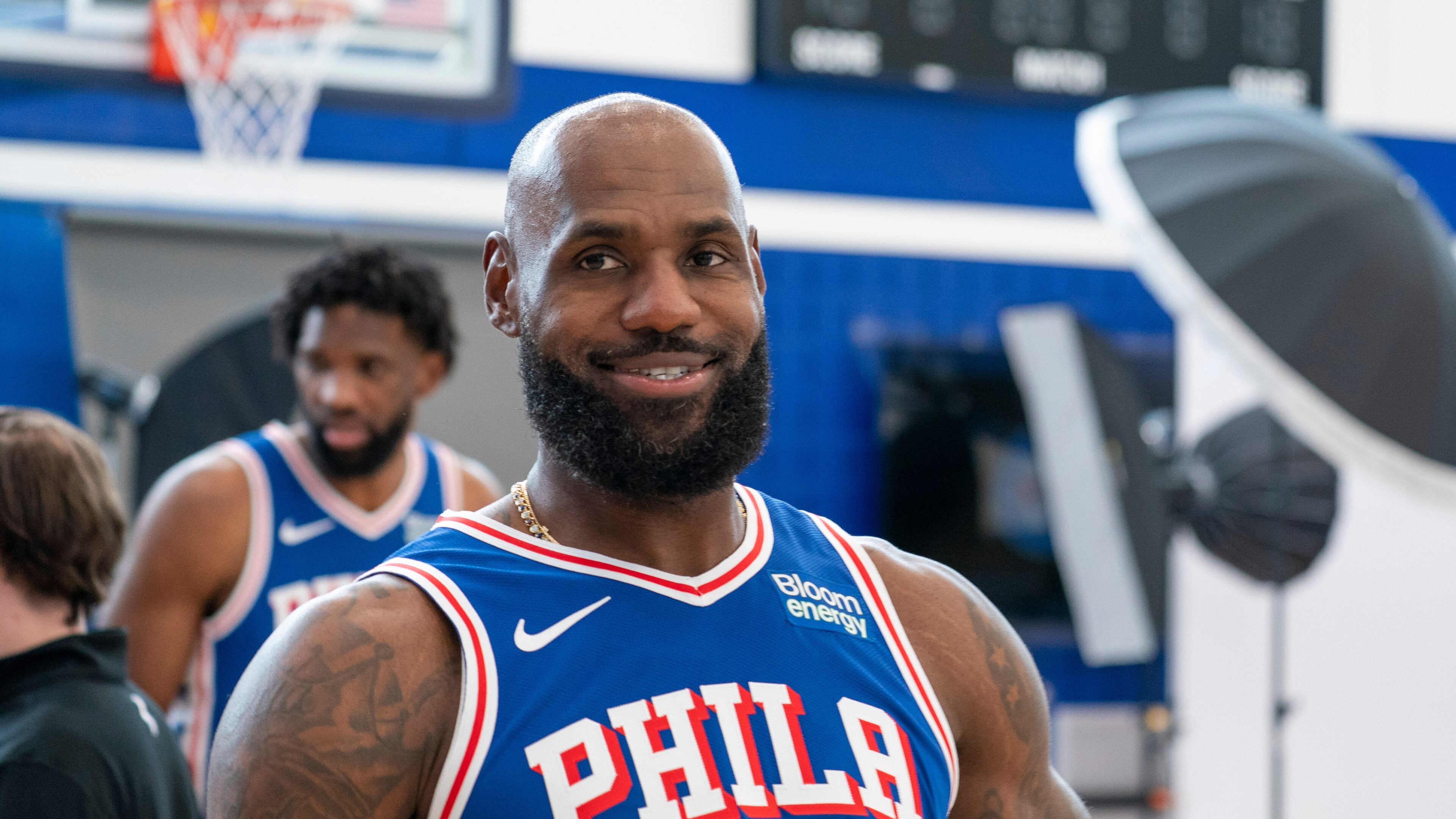 Philadelphia 76ers' LeBron James reacts as he goes between stations during the NBA basketball team's media day, Monday, Sept. 28, 2026, in Camden, N.J.. (AP Photo/Chris Szagola)