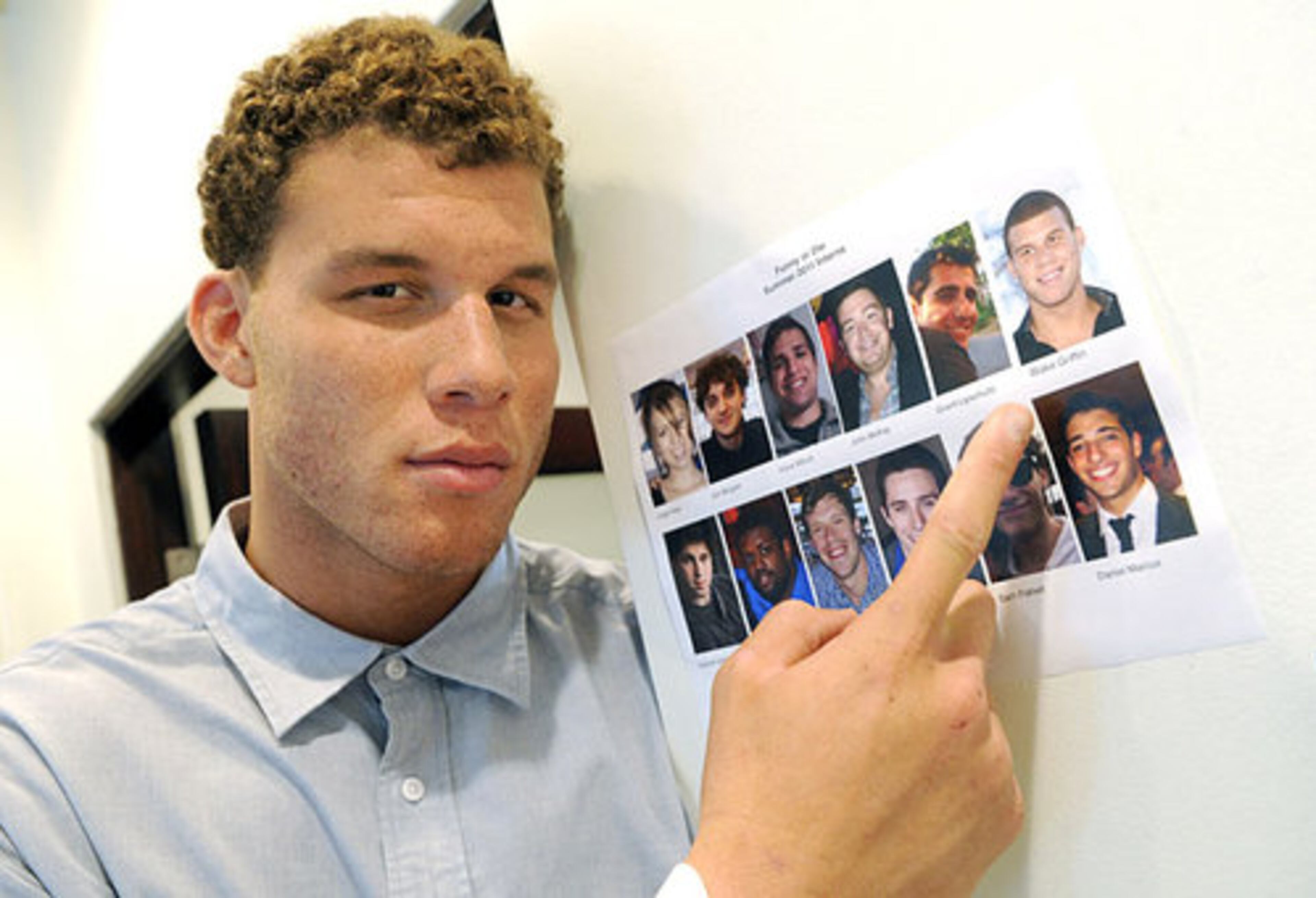 Los Angeles Clippers basketball player Blake Griffin points to his picture on an ID page of summer interns during the first day of his week-long internship at comedy video website Funny Or Die, Tuesday, Aug. 23, 2011, in Los Angeles. A fan of Funny Or Die and comedy in general, Blake will spend the week on tasks ranging from running office errands to helping out on productions. AP/CHRIS PIZZELLO