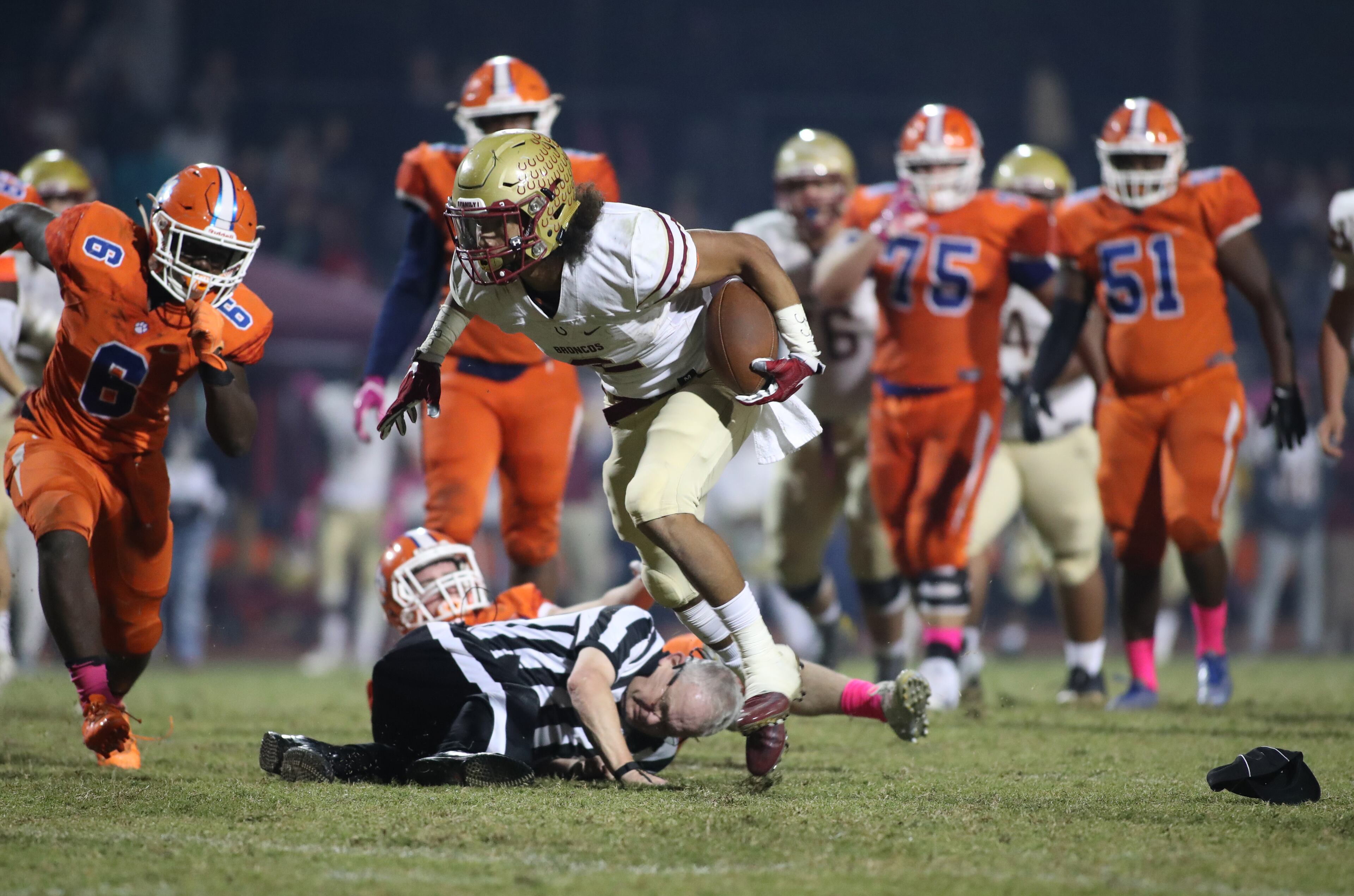 October 20, 2017 - Lilburn, Ga: Brookwood wide receiver Matthew Hill (2) stays upright after colliding with an official during a run in the second half of their game against Parkview at Parkview High School Friday, October 20, 2017, in Lilburn, Ga.. Brookwood won 30-27. PHOTO / JASON GETZ