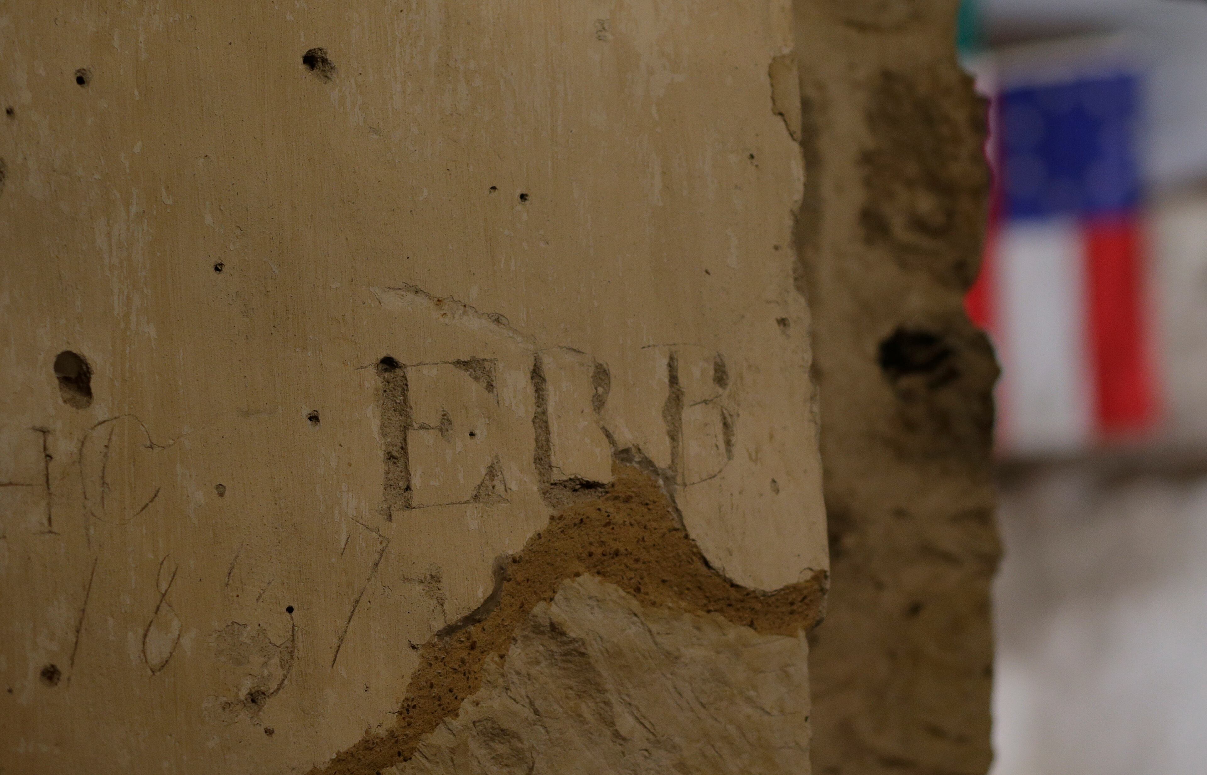 A date and initials are seen etched into an interior wall of the Alamo, Thursday, Jan. 9, 2014, in San Antonio. A team is assembling digital two- and three-dimensional highly defined photos and laser images as part of a nearly 2-year-long project to help aid in preservation of the famous shrine to Texas independence.
