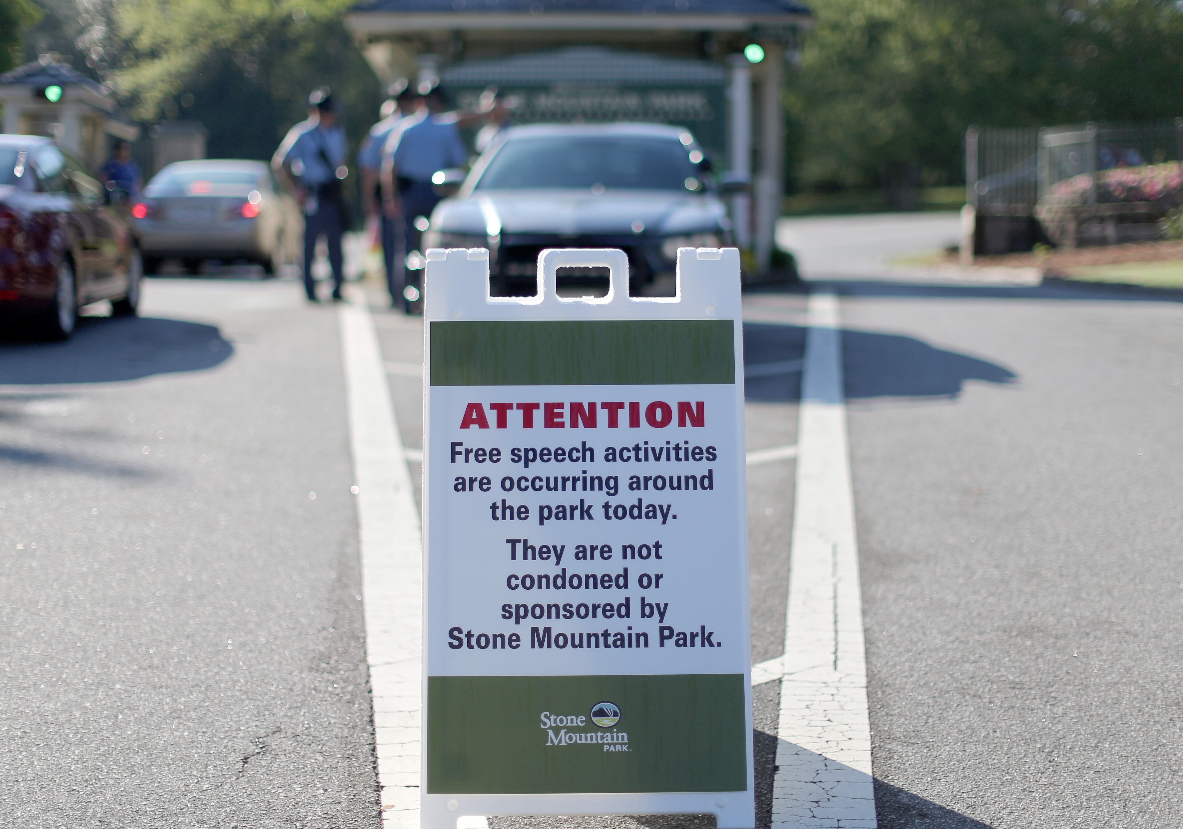 A warning sign sits at the West entrance to Stone Mountain Park on Saturday morning, April 23, 2016 where a white power protest and two counter protests were scheduled. Ben Gray / bgray@ajc.com