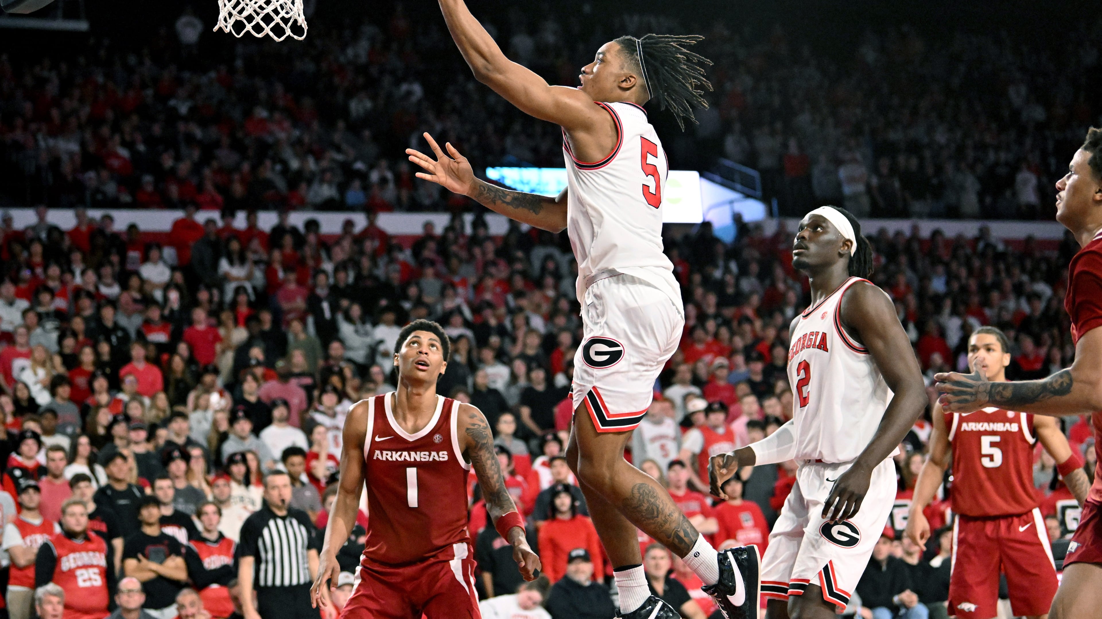 Georgia guard Jeremiah Wilkinson (5) goes in for a lay-up during the second half in an NCAA college basketball game at Stegeman Coliseum, Saturday, Jan. 17, 2026, in Athens. Georgia won 90-76 over Arkansas. (Hyosub Shin/AJC)