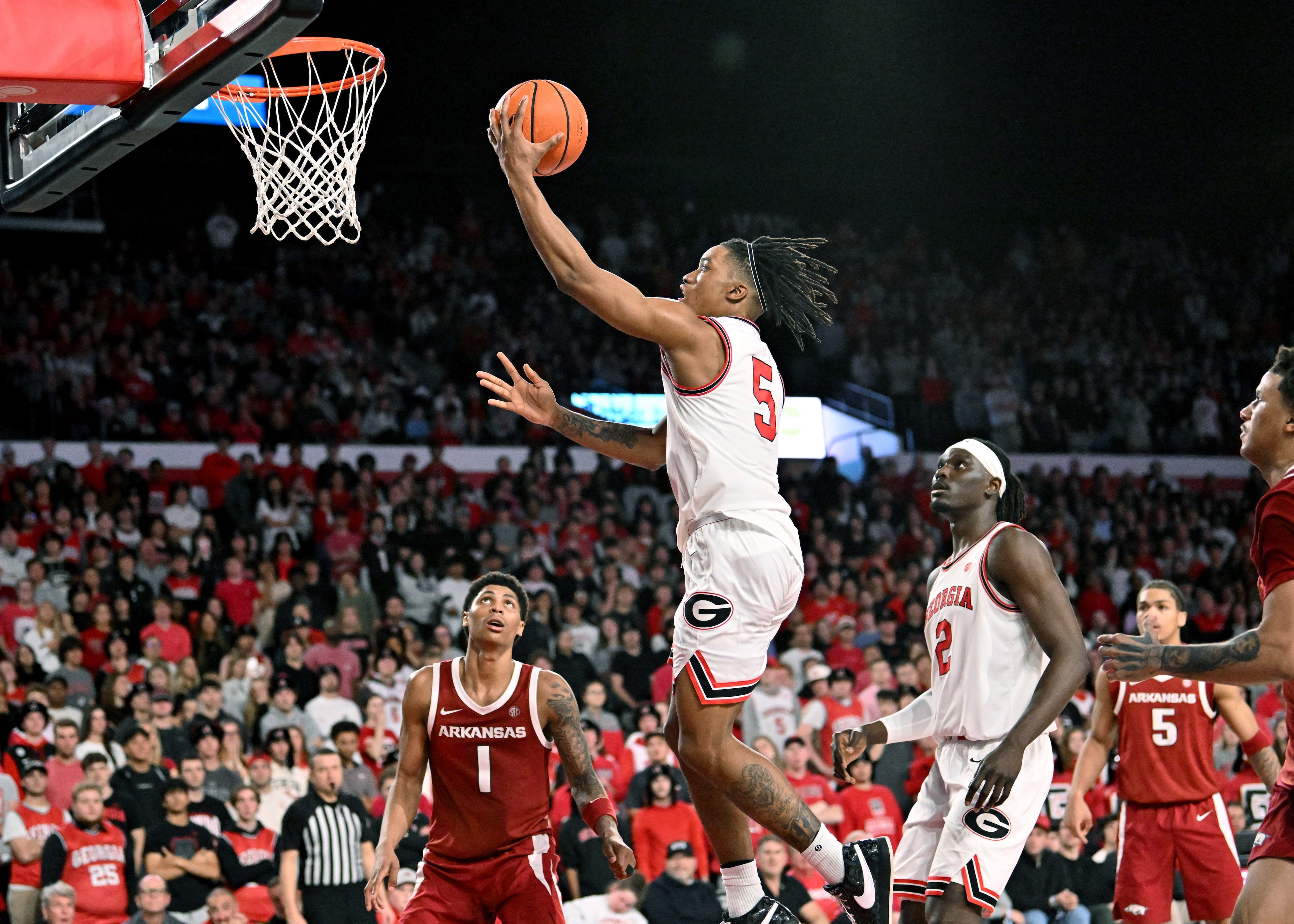 Georgia guard Jeremiah Wilkinson goes in for a lay-up during the second half in an NCAA college basketball game at Stegeman Coliseum, Saturday, Jan. 17, 2026, in Athens. Georgia won 90-76 over Arkansas. (Hyosub Shin/AJC)