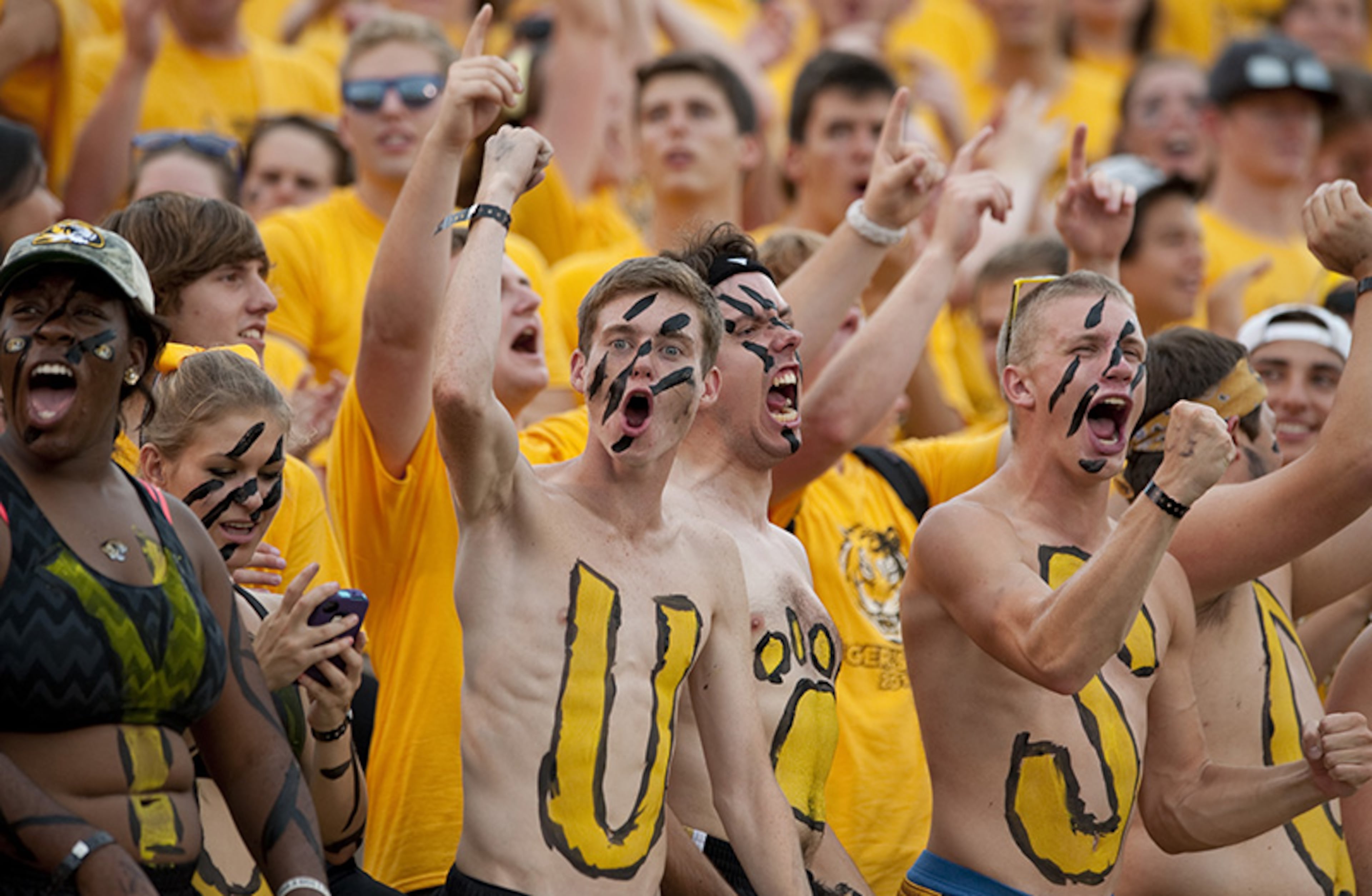 Fans celebrate during the first quarter of an NCAA college football game between Missouri and Murray State Saturday, Aug. 31, 2013, in Columbia, Mo.