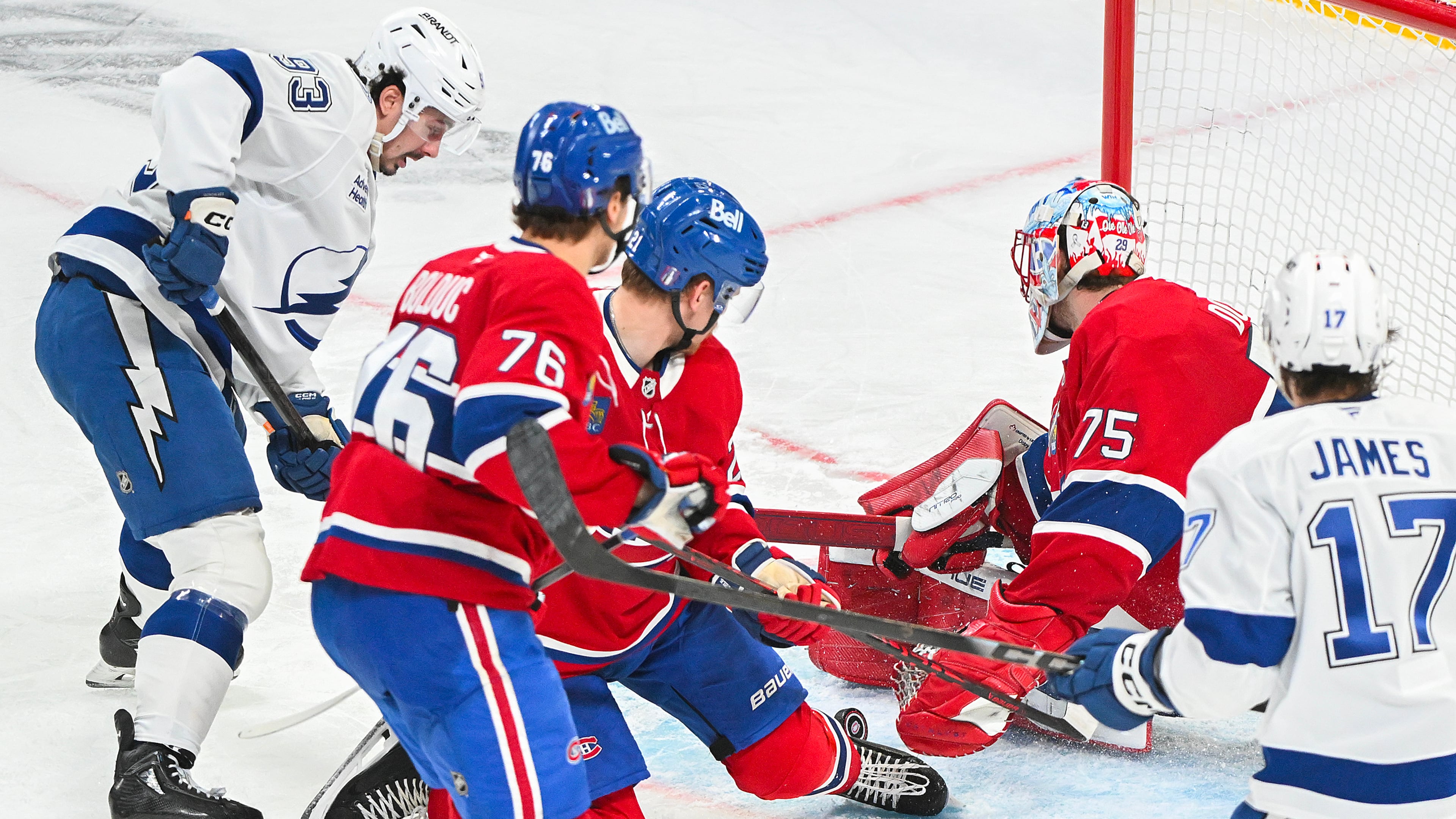 Tampa Bay Lightning's Gage Goncalves (93) scores against Montreal Canadiens goaltender Jakub Dobes (75) during overtime of Game 6 in the first round of an NHL hockey Stanley Cup playoff series in Montreal, Friday, May 1, 2026. (Graham Hughes/The Canadian Press via AP)