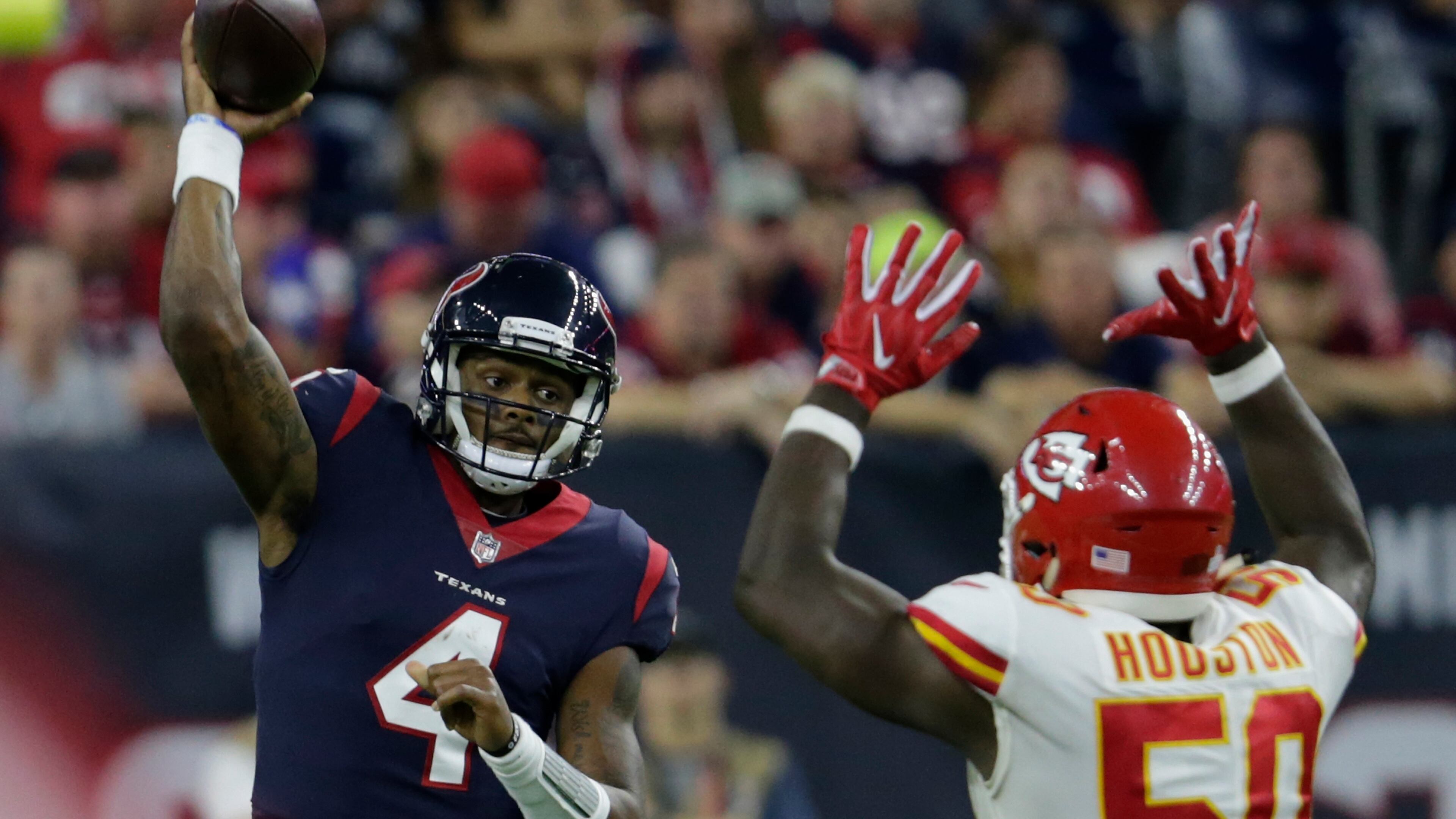 Texans quarterback Deshaun Watson throws a pass under pressure by Justin Houston of the Chiefs in the fourth quarter at NRG Stadium last Sunday night in Houston.