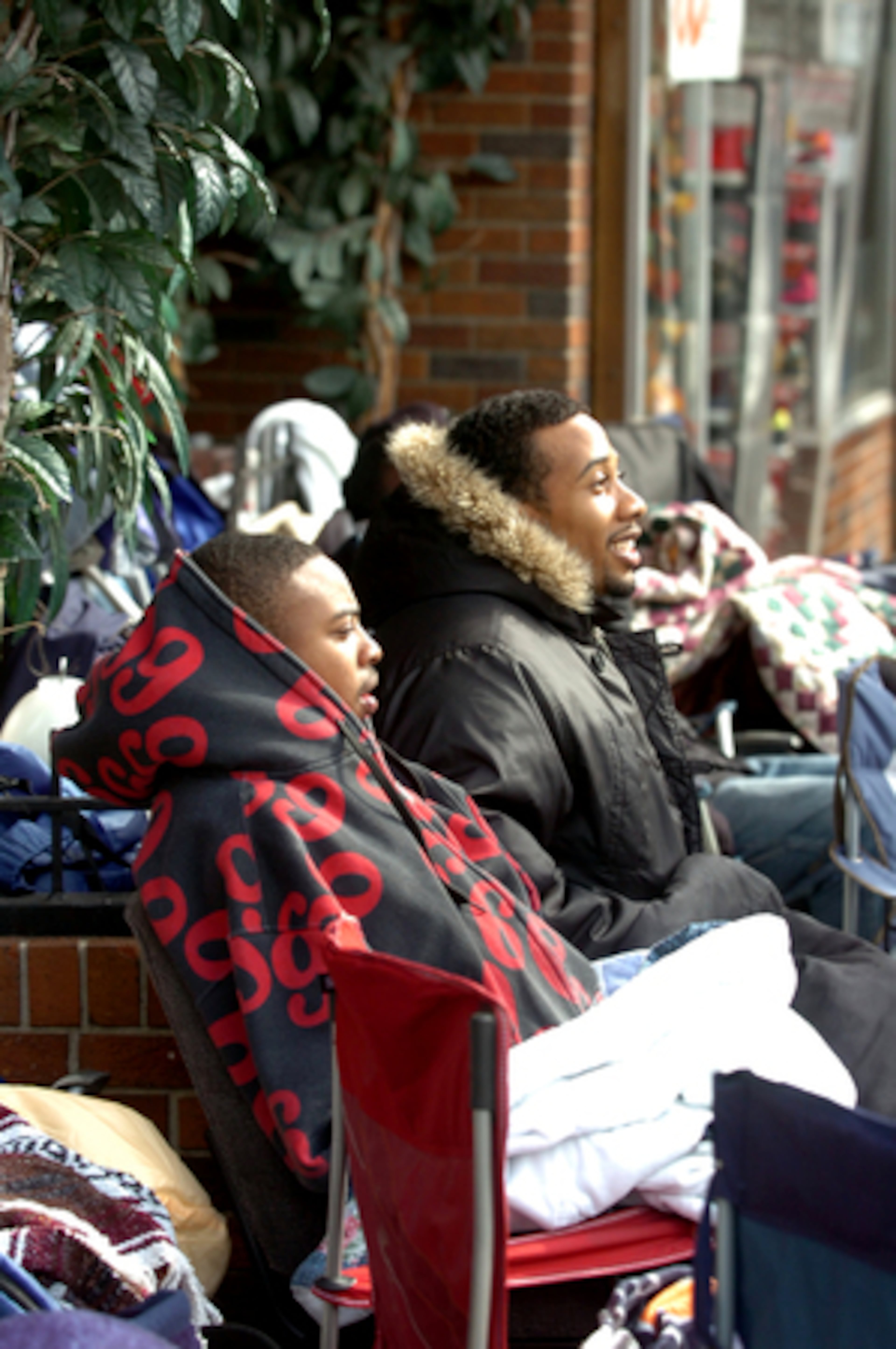 James Coleman (left) from Lithonia, and Brandon Barnes, from Stone Mountain, wait with others at Walter's shoe store in downtown Atlanta to get their hands on the much-hyped 23rd edition Nike Air Jordans, which go on sale Friday morning. Only 23 pairs will be sold in Georgia for $230 - a price most say is worth it.