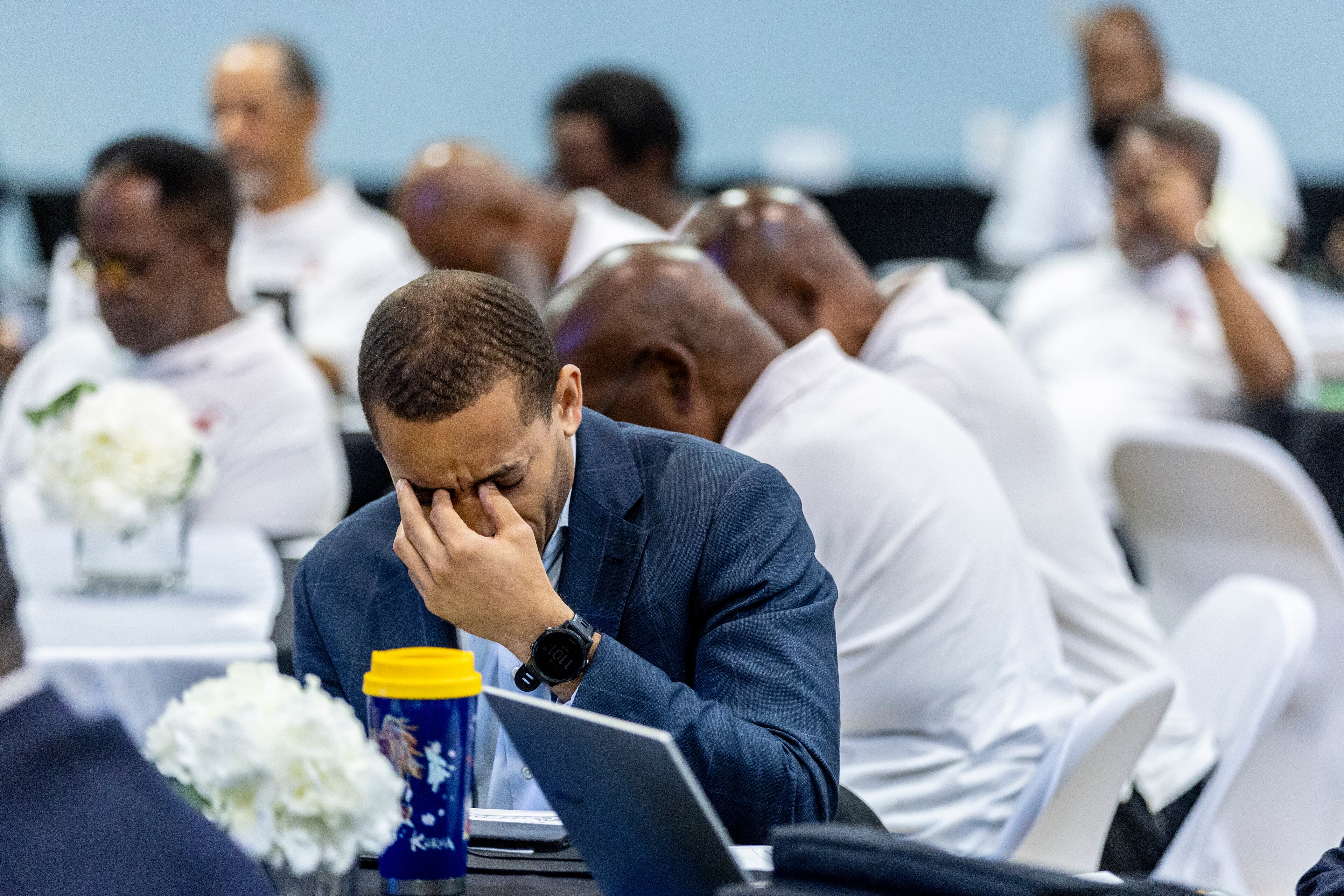 Participants pray during the opening statements at the inaugural Greater Atlanta Congress of Black Men Conference at Mt. Ephraim Baptist Church in Atlanta Saturday, July 13, 2024 (Steve Schaefer / AJC)