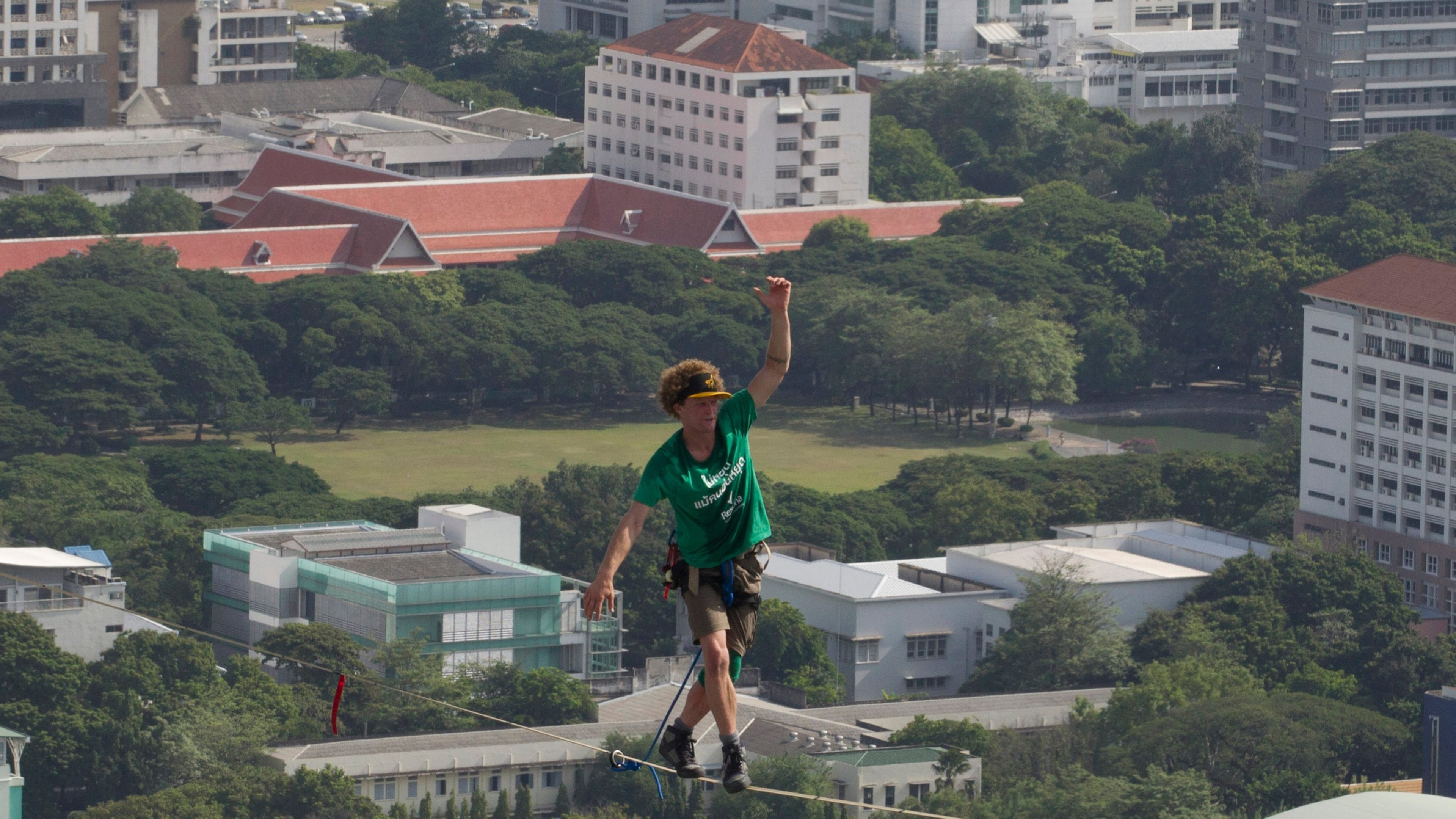 FILE - U.S. slackliner Andy Lewis of Calif. balances on a slackline in Bangkok, Thailand, July 23, 2014. (AP Photo/Sakchai Lalit, File)