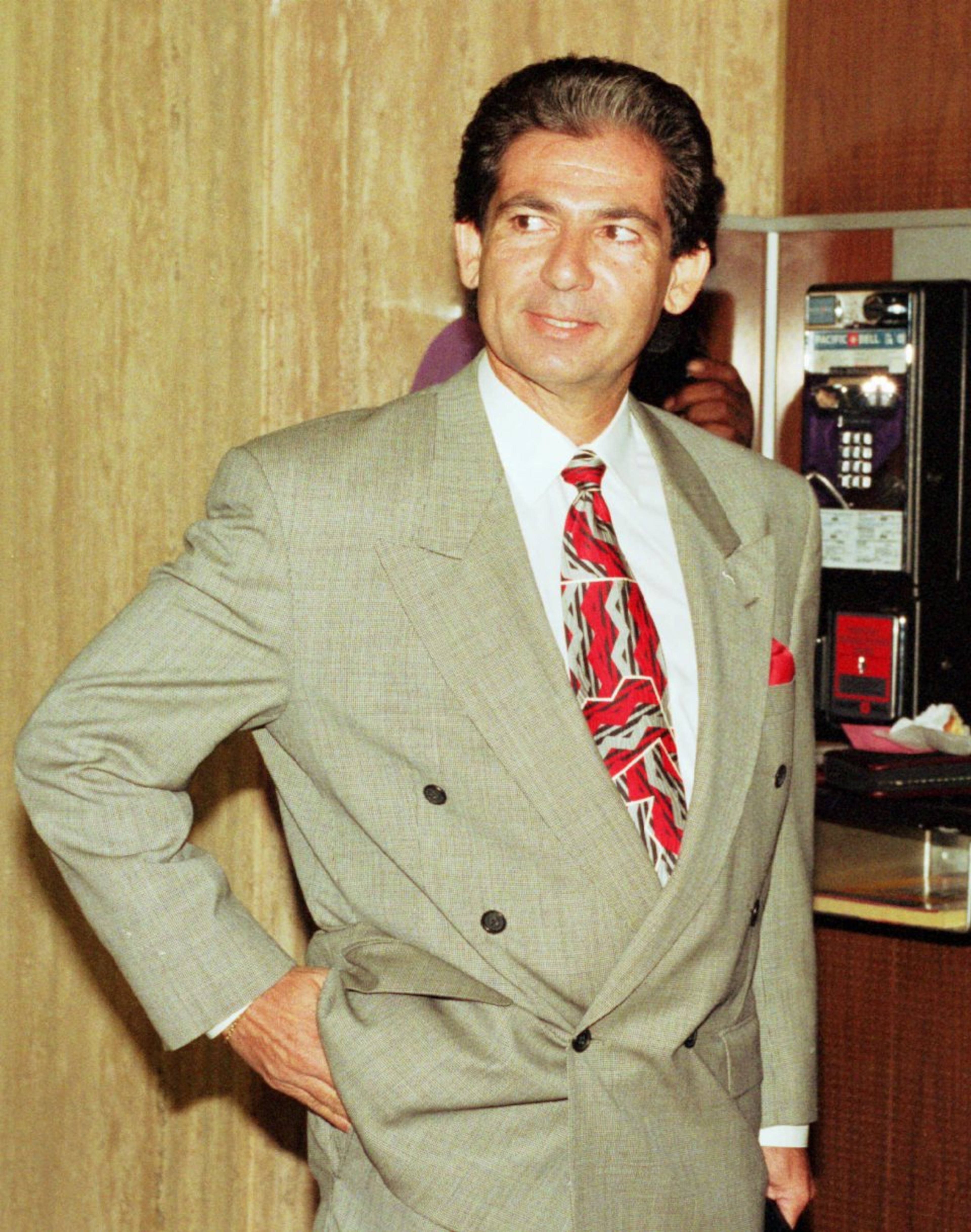 Robert Kardashian, Simpson's friend and associate, waits outside the grand jury room in Los Angeles. Simpson stayed in Kardashian's house during the days following the June 12, 1994, murders of Nicole Brown Simpson and Ronald Goldman. Kardashian was the man seen carrying Simpson's garment bag the day that Simpson flew back from Chicago. Kardashian died of esophageal cancer on September 30, 2003 at the age of 59, only eight weeks after his diagnosis. (Nick Ut/AP)
