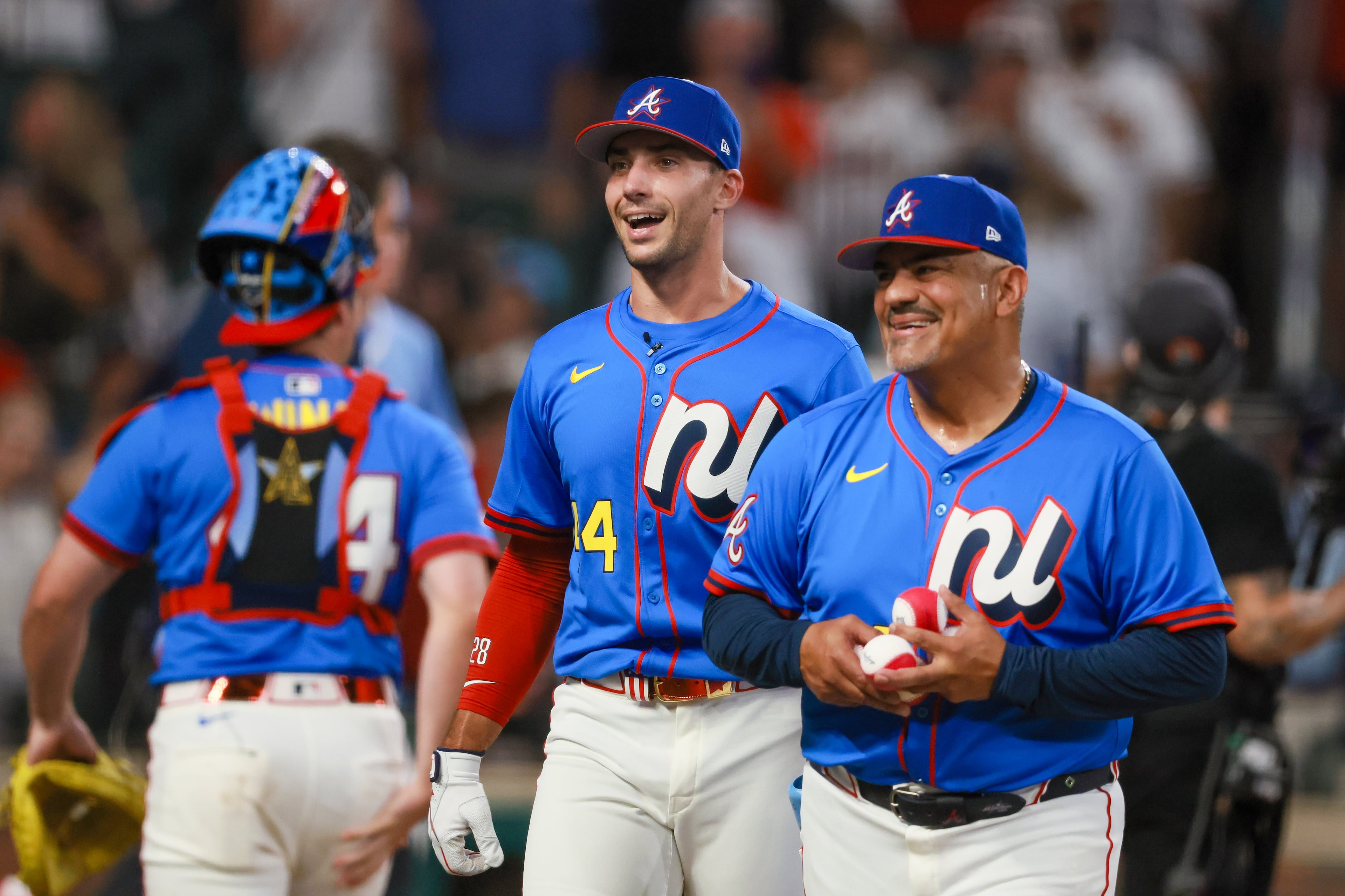 Atlanta Braves' first baseman Matt Olson is greeted by outfielder Ronald Acuna Jr. and Braves coach Eddie Perez after batting during the MLB Home Run Derby as part of the All-Star Game festivities on Monday, July 14, 2025 at Truist Park in Atlanta. Jason Getz / AJC