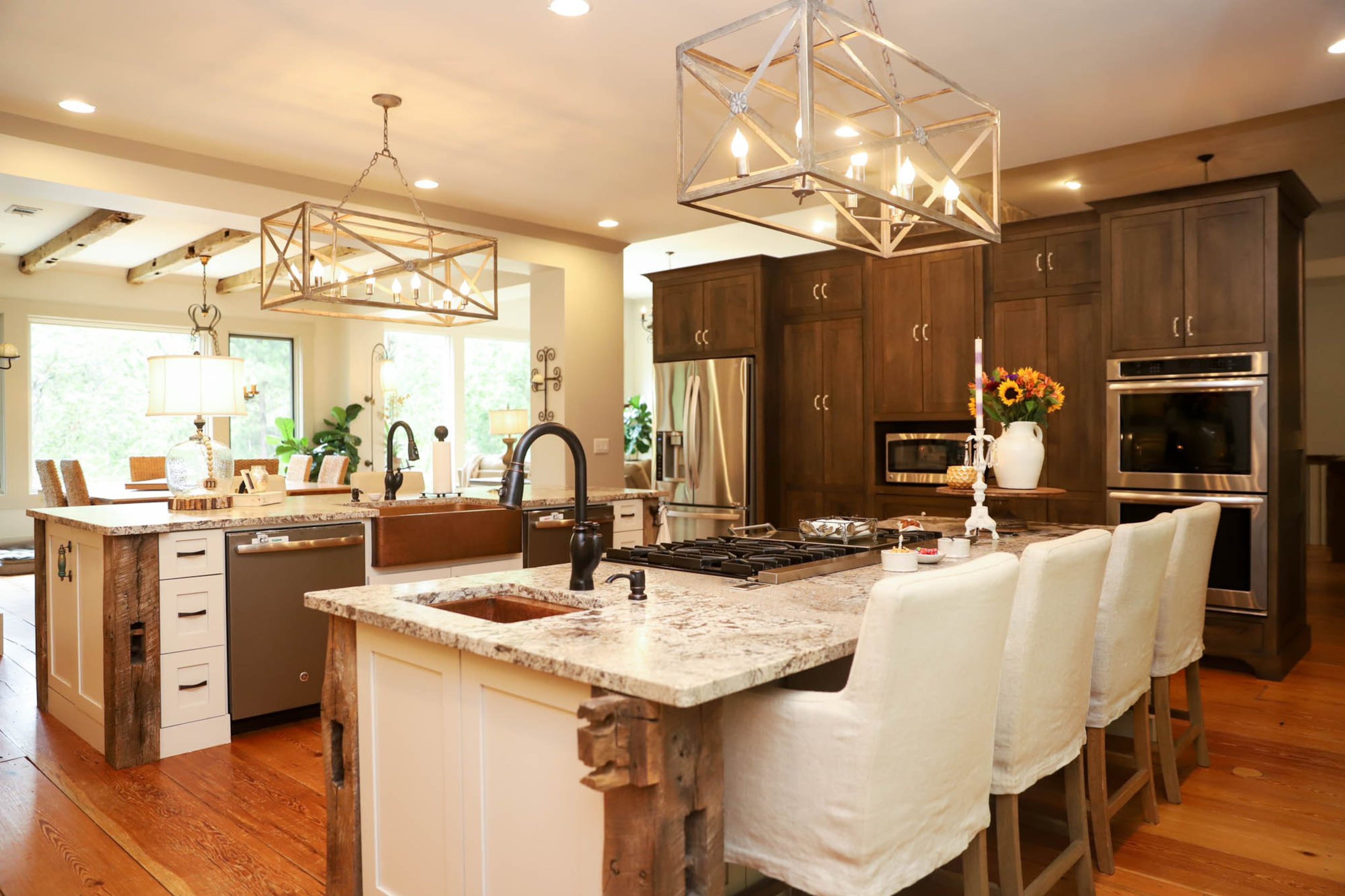 Jenniffer Marblestone’s favorite features of her kitchen are the double islands. Each island is 10 feet long with a countertop of leathered granite and a large pendant light from Scott Antique Markets overhead. Having all of that counter space is perfect when the Marblestones entertain, which they do often. Their bar stools are from RH. Text by Shannon Dominy. Photo by Reynolds Rogers.