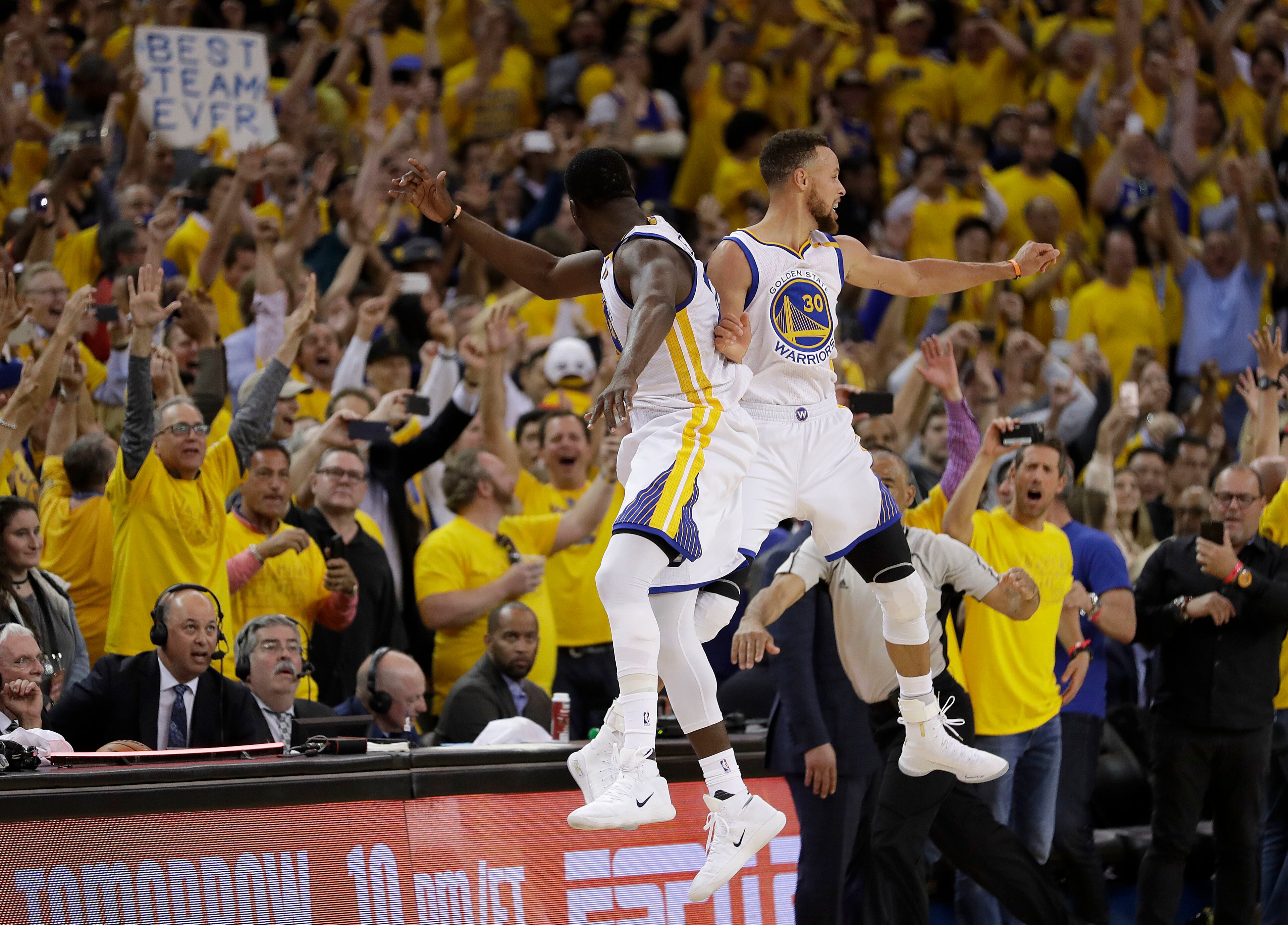 Golden State Warriors forward Draymond Green, left, and guard Stephen Curry (30) celebrate during the second half of Game 5 of basketball's NBA Finals against the Cleveland Cavaliers in Oakland, Calif., Monday, June 12, 2017. The Warriors won 129-120 to win the NBA championship. (AP Photo/Marcio Jose Sanchez)