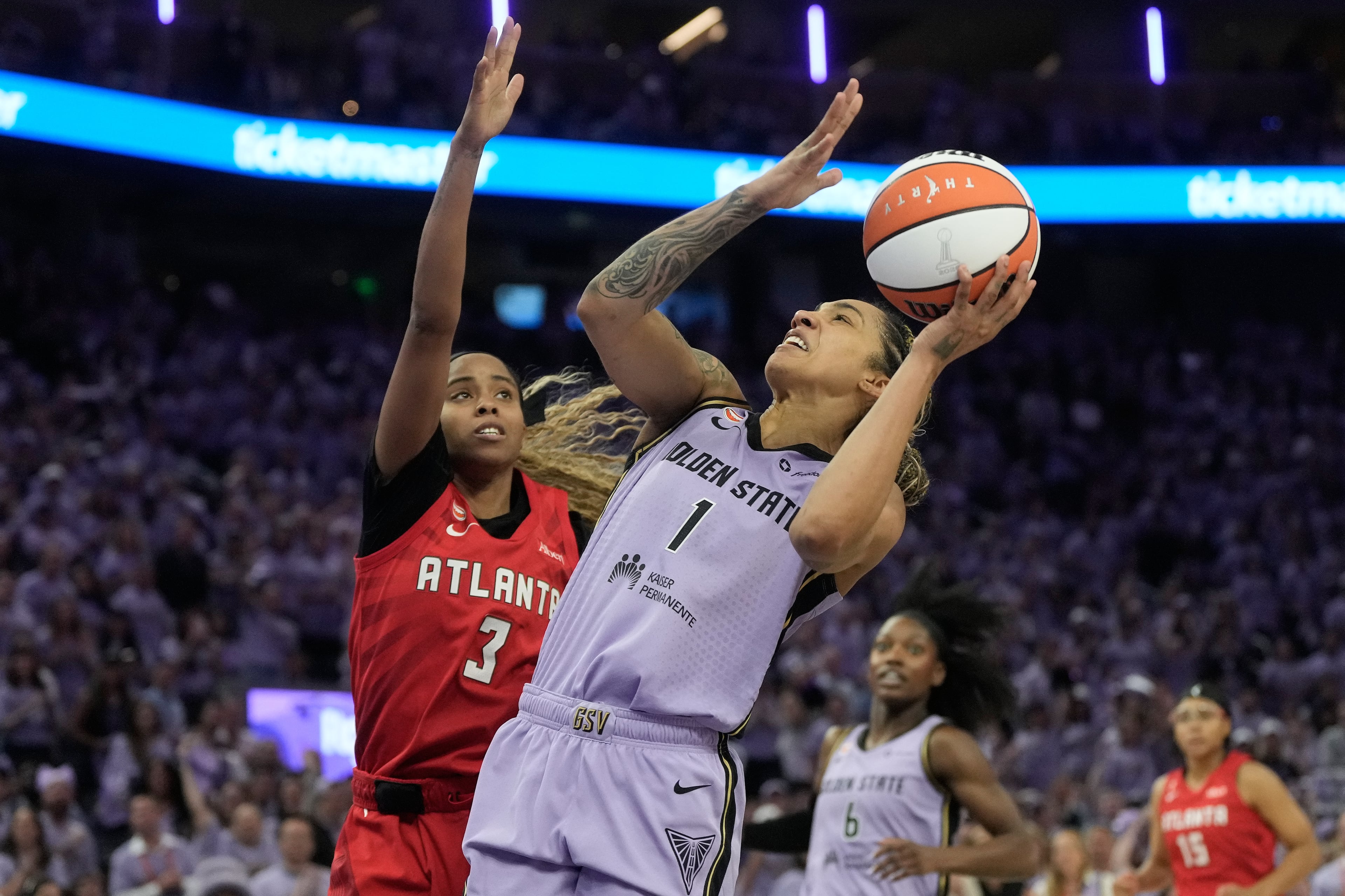 Golden State Valkyries forward Gabby Williams (1) shoots against Atlanta Dream guard Jordin Canada (3) during the first half of Game 1 of the WNBA basketball finals, Saturday, Oct. 17, 2026, in San Francisco. (AP Photo/Jeff Chiu)