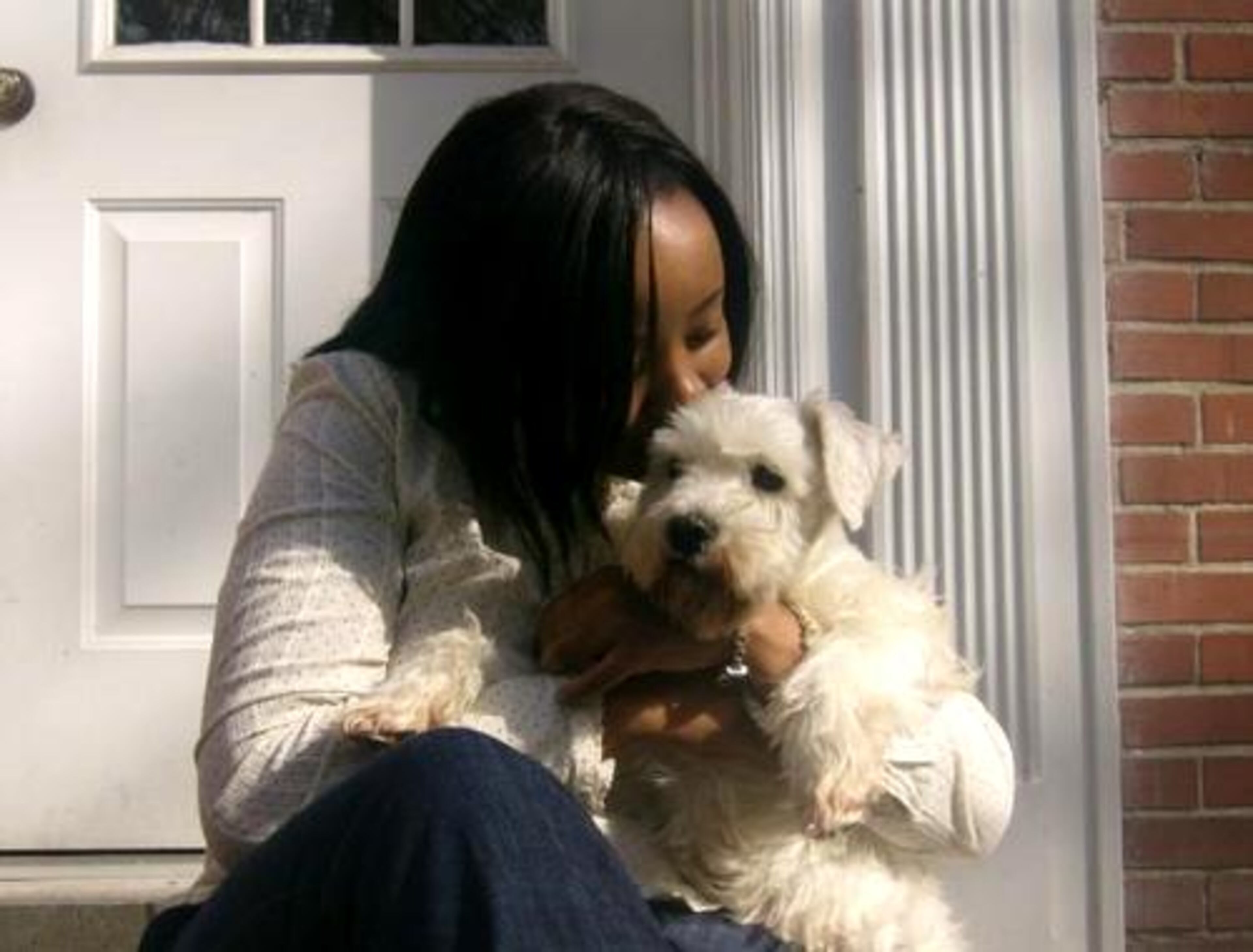 This is my girlfriend , Jasmine McGinnis, with Nibot our 3-year-old mini schnauzer adopted from the local shelter. Although he looks like he doesn't want to be kissed, he is VERY affectionate!