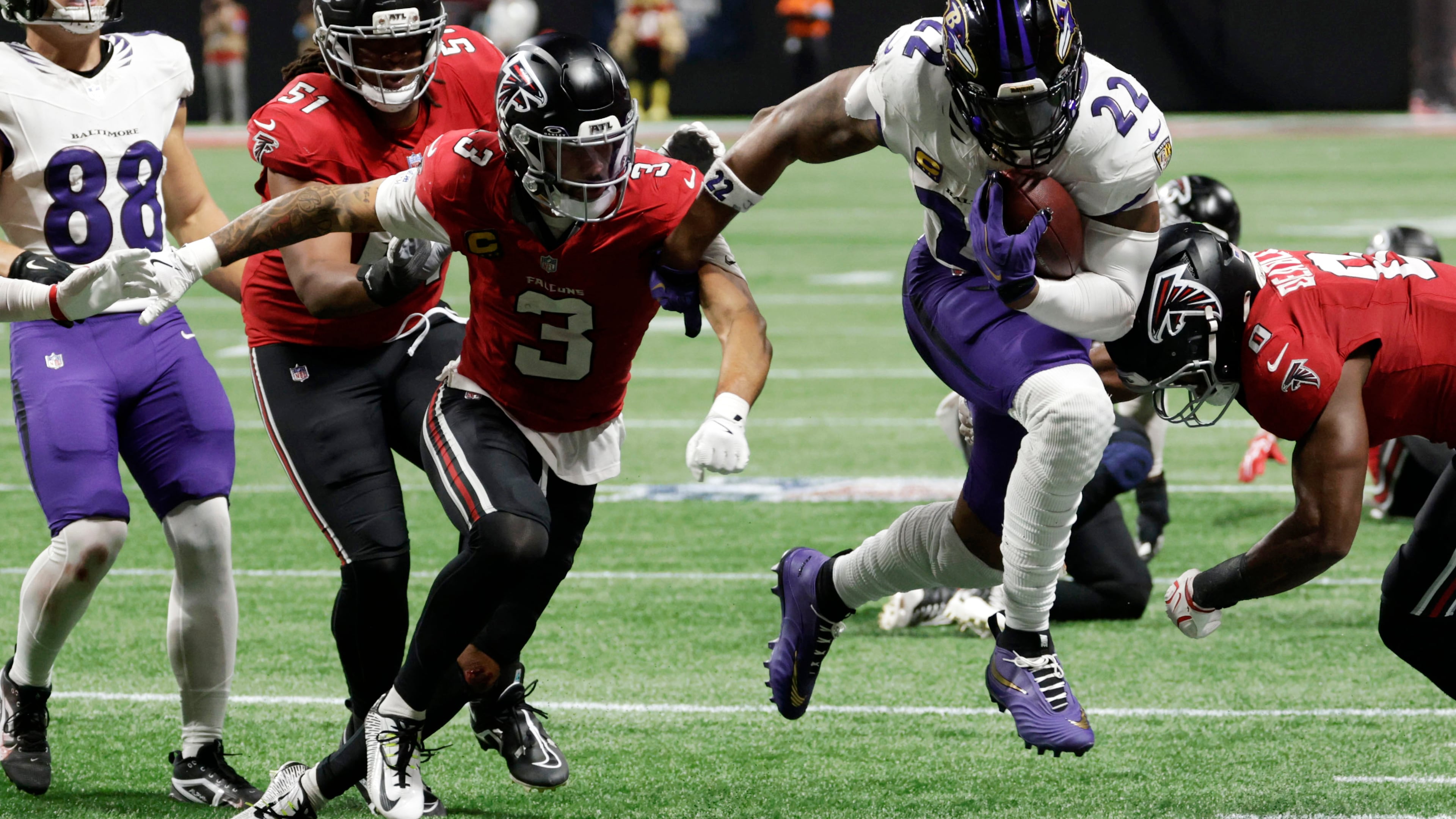 Baltimore Ravens running back Derrick Henry runs from Atlanta Falcons safety Jessie Bates III during overtime in a NFL football game, Sunday, Oct. 11, 2026, in Atlanta. (Erik S. Lesser/AP)
