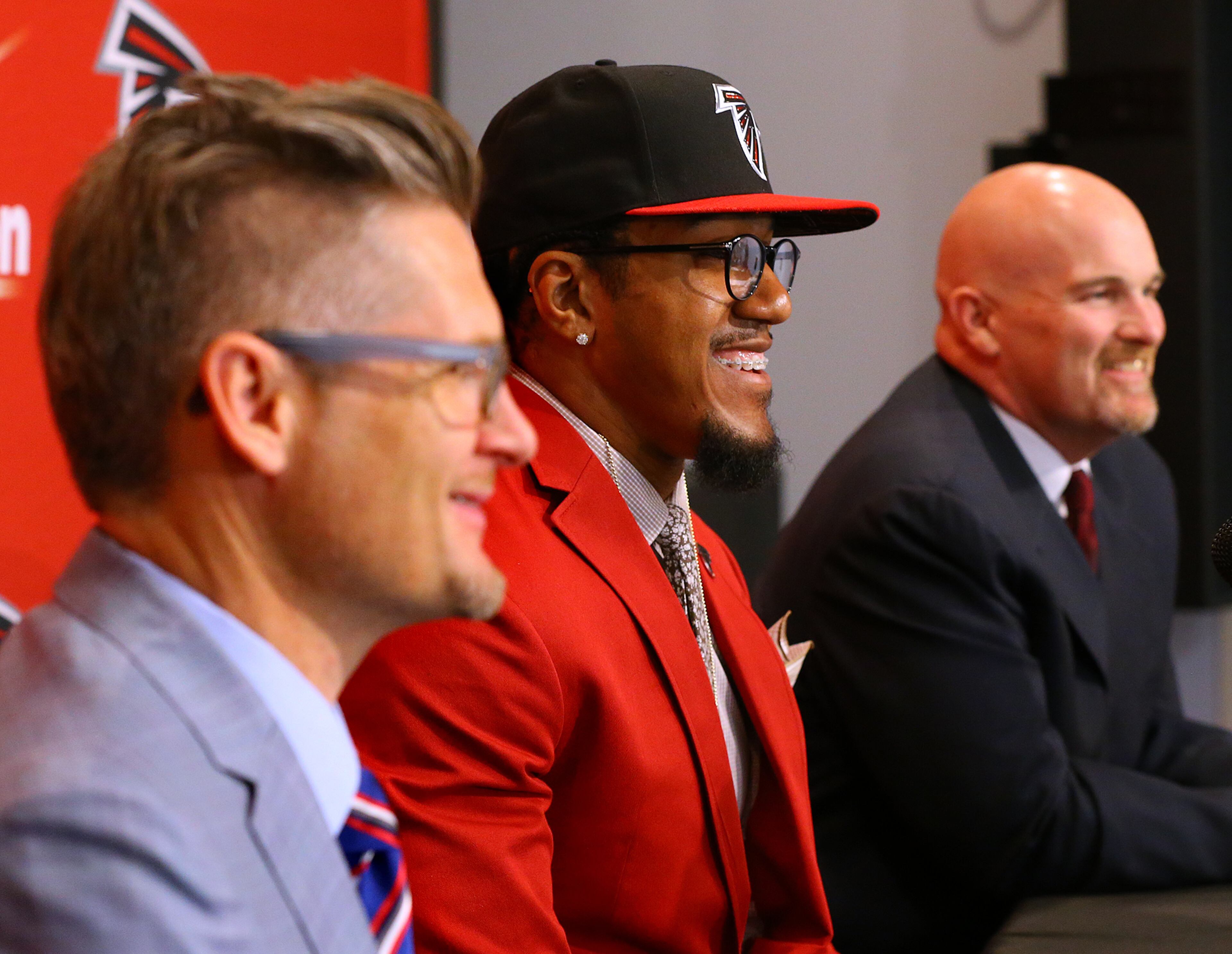Falcons General Manager Thomas Dimitroff (from left), first round draft pick Vic Beasley and head coach Dan Quinn share a laugh at the Falcons training facility in Flowery Branch. Beasley, who was the 8th overall pick in the NFL draft, is Clemson's all-time sack leader. Curtis Compton / ccompton@ajc.com