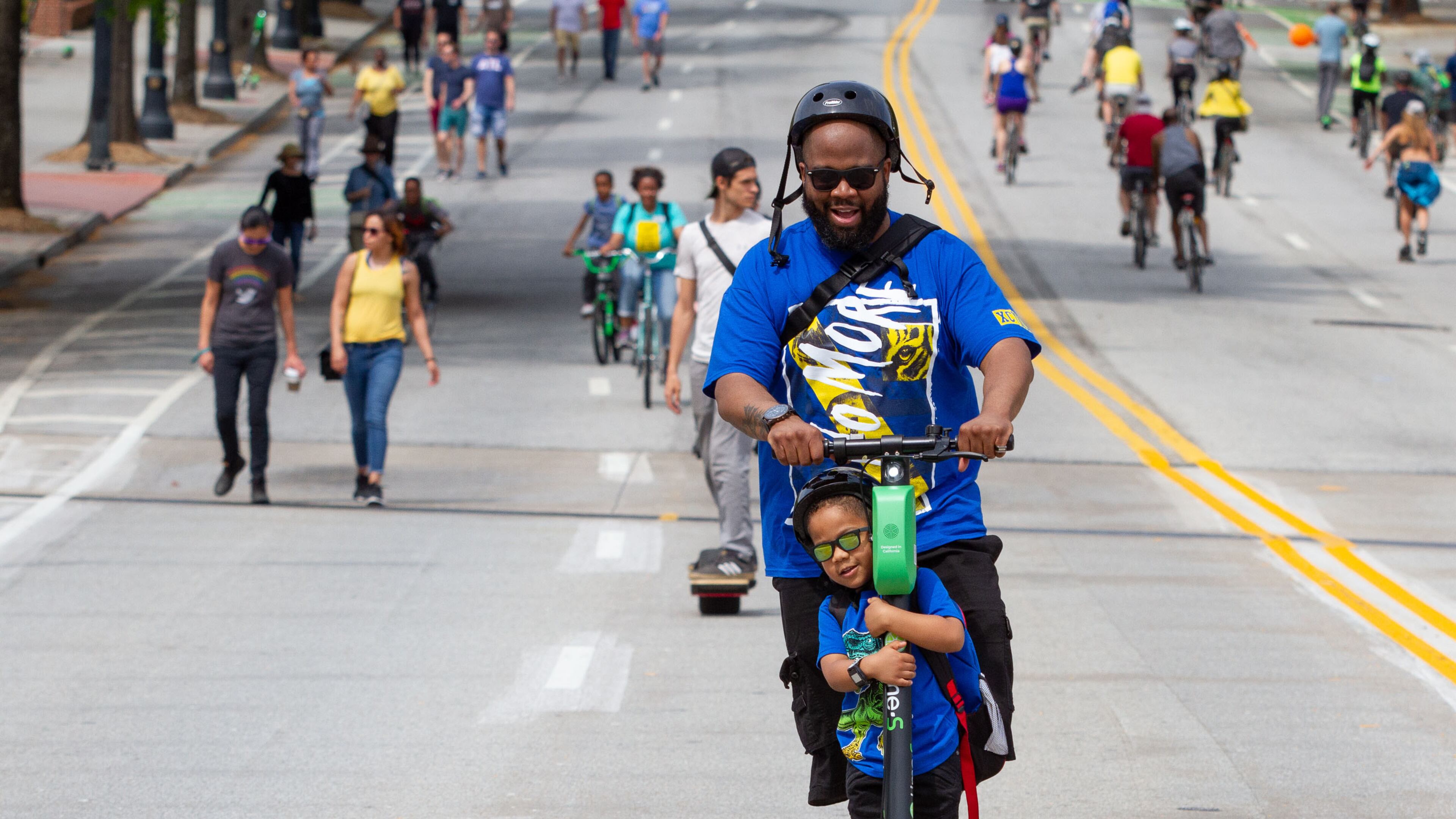 Corey Wills and his son C.J. make their way down Peachtree Street during the Atlanta Streets Alive ride Sunday, April 7, 2019. Atlanta Bicycle Coalition activated 3.1 miles of Peachtree Street for the Sunday afternoon ride. STEVE SCHAEFER / SPECIAL TO THE AJC