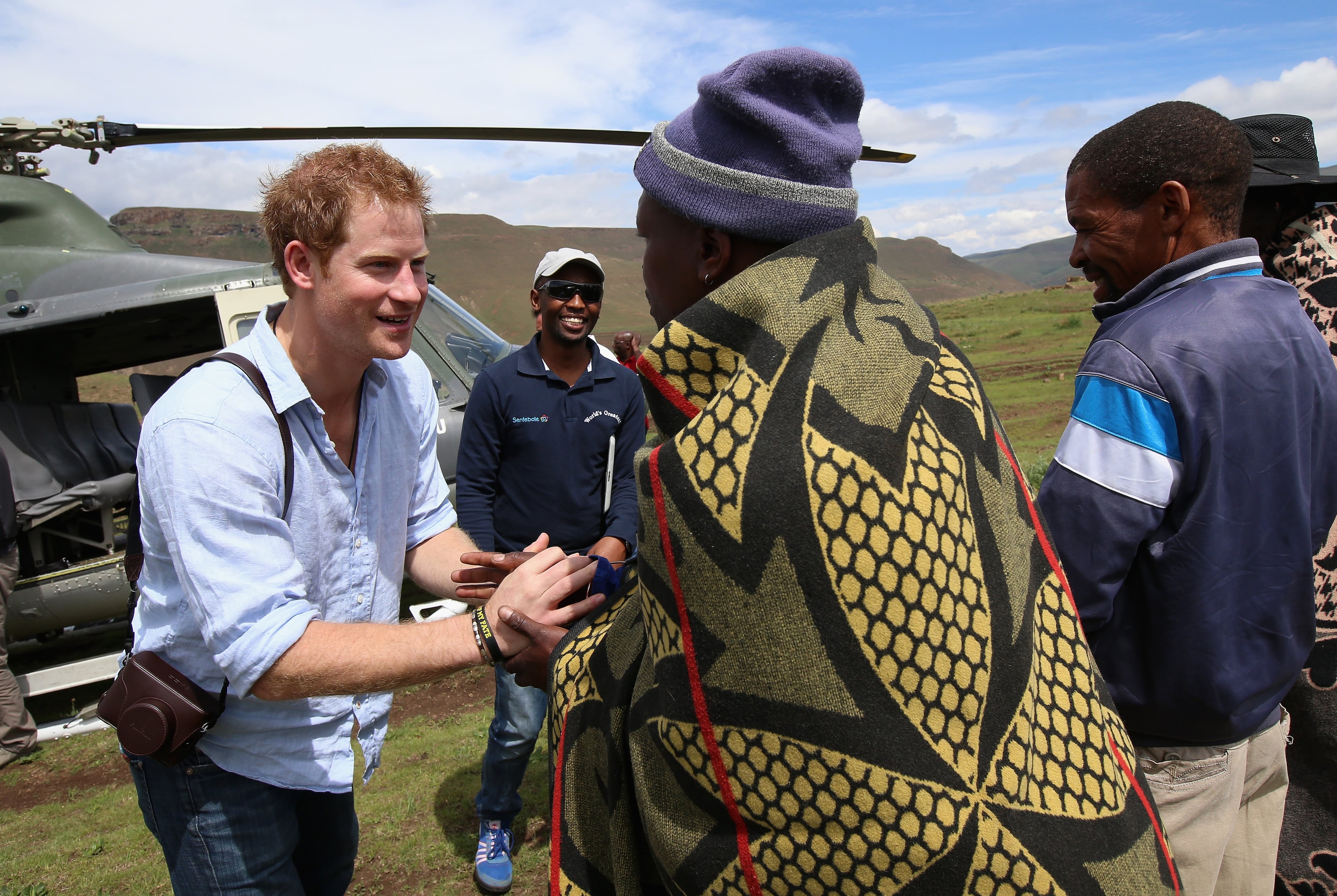 Prince Harry arrives for a visit to a herd boy night school constructed by Sentebale on December 8, 2014 in Mokhotlong, Lesotho. Prince Harry was visiting Lesotho to see the work of his charity Sentebale. Sentebale provides healthcare and education to vulnerable children in Lesotho, Southern Africa. The particular theme of his visit was to check on the progress of the Mamohato Childrens Centre which will provide vital support to children affected by HIV. Prince Harry founded Sentebale (which means Forget Me Not in Sesotho) with Prince Seeiso in 2006. (Photo by Chris Jackson/Getty Images for Sentebale)
