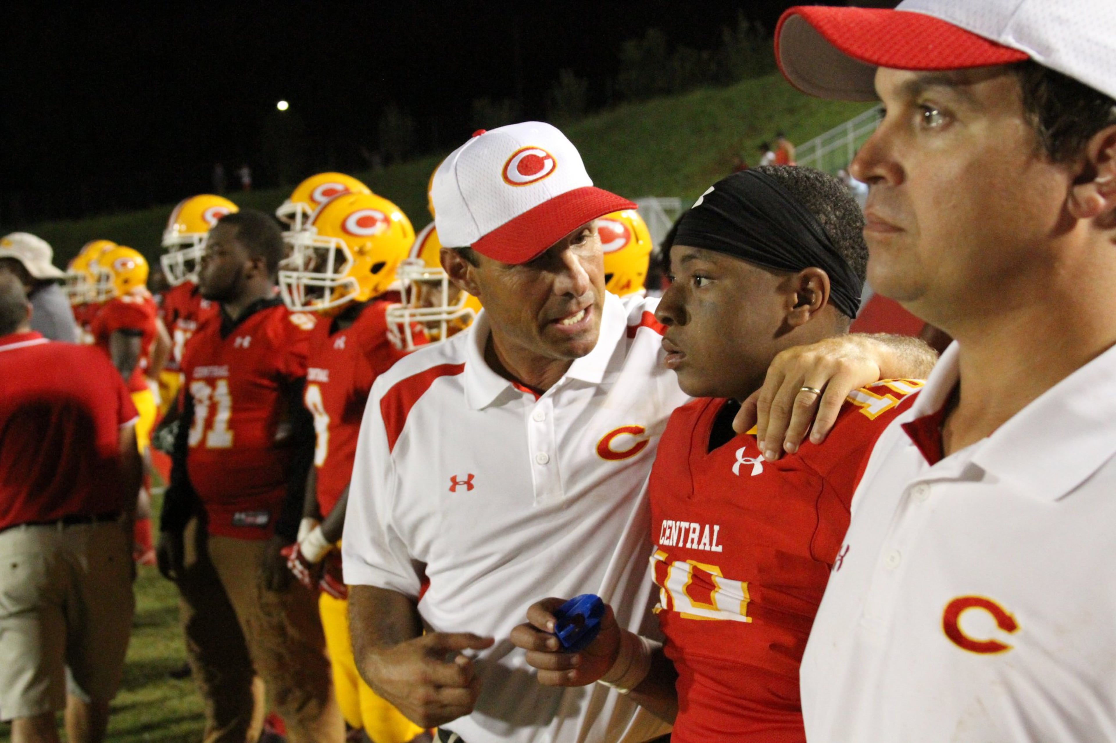 Clarke Central coach David Perno bucks up wide receiver Jacorie Jordan during game at Loganville in 2020. (Special/Bill Thomas)