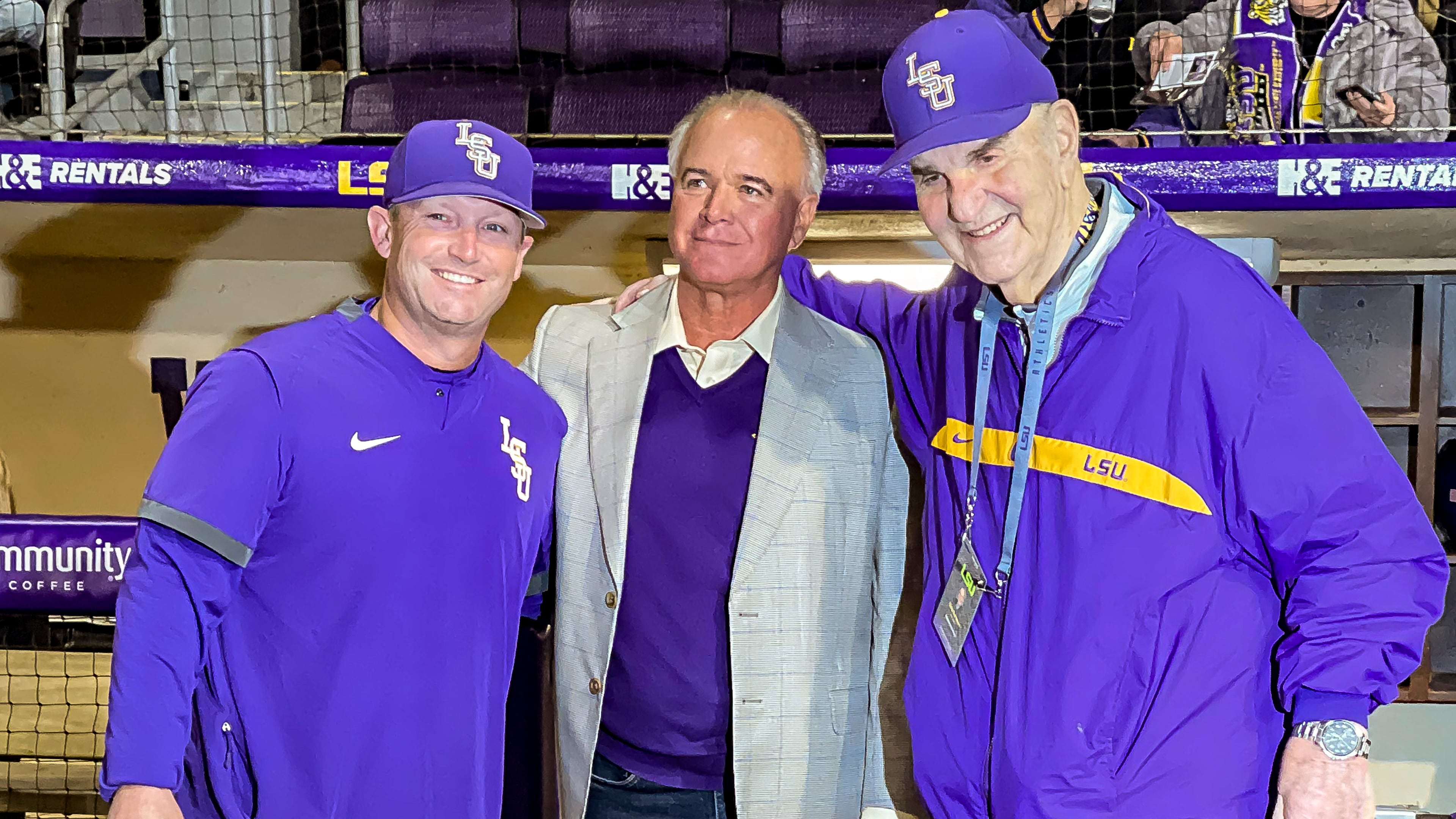 FILE - LSU head coach Jay Johnson, left, smiles with retired head coach Paul Mainieri, and head coach Skip Bertman before an NCAA baseball game against Maine on Feb. 18, 2022, in Baton Rouge, (AP Photo/Matthew Hinton, File)