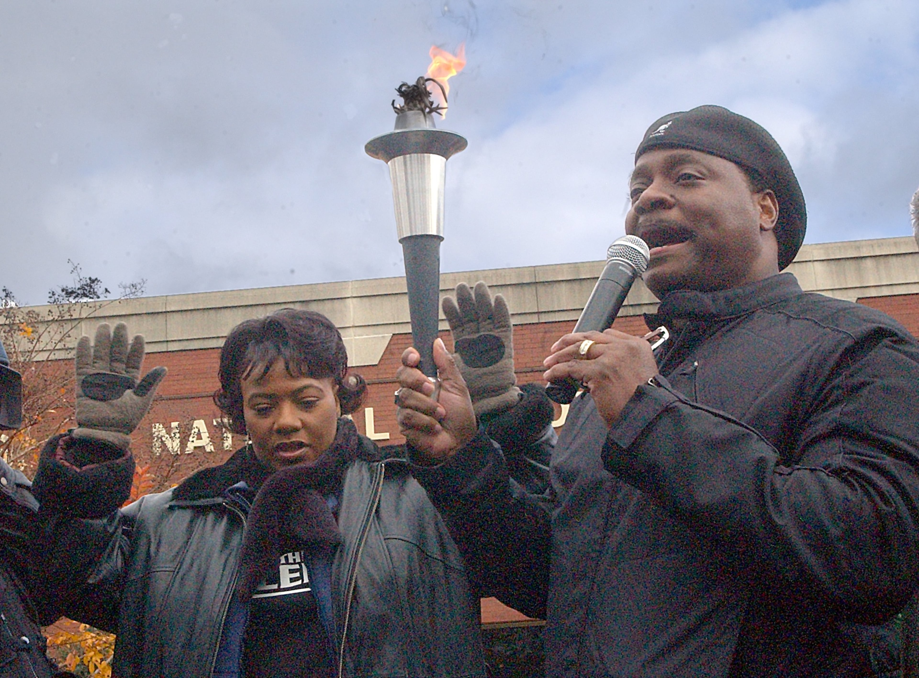At the Martin Luther King National Historic Site, Bernice King, left, and Bishop Eddie Long pray December 11, 2004 after passing the torch at the start of a march against gay marriage and other issues.
