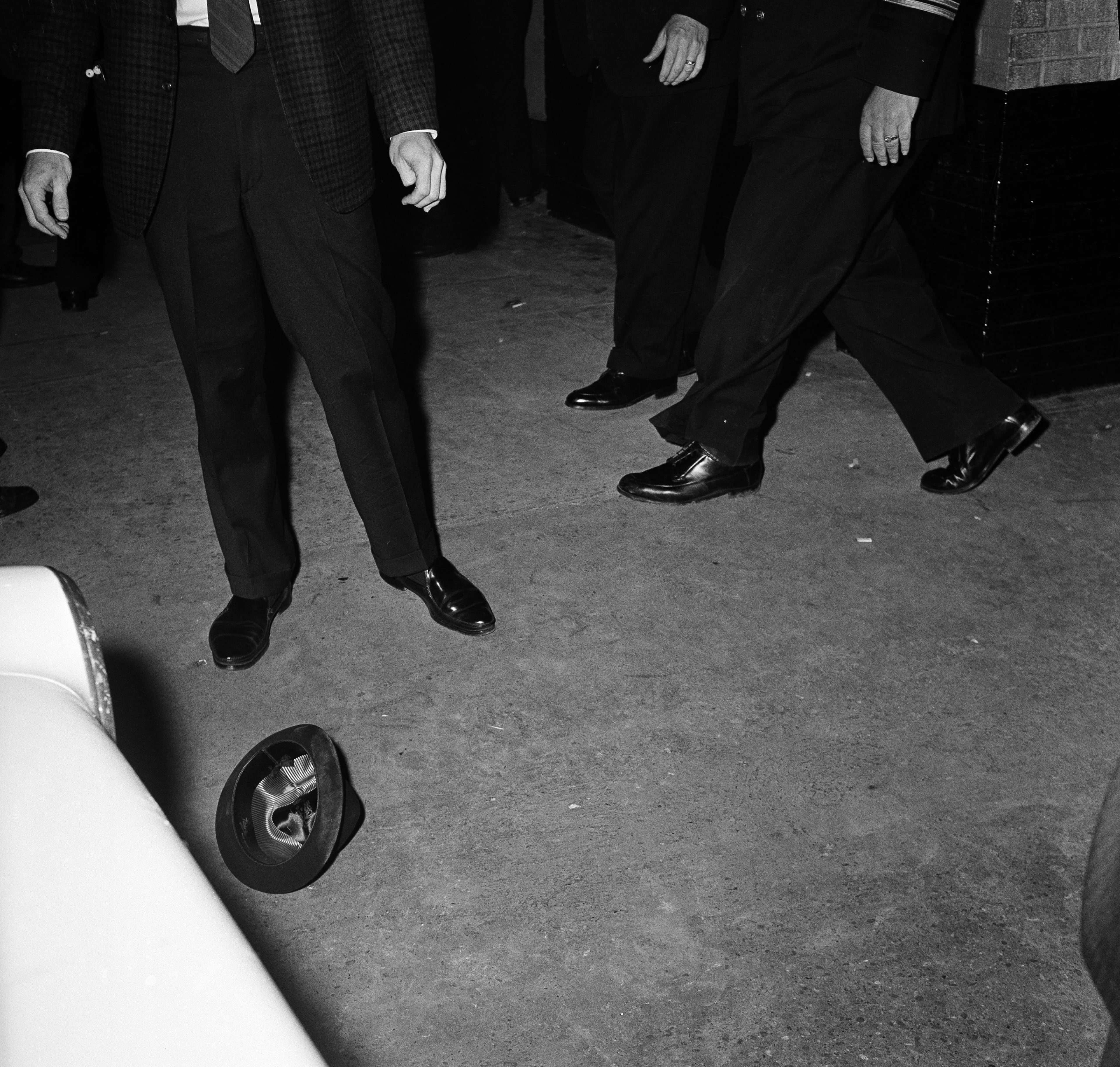 Police and reporters react after the shooting of Lee Harvey Oswald, President Kennedy's assassin, in Dallas, Tex., Nov. 24, 1963. Hat belonging to Oswald's shooter, Jack Ruby, is shown. (AP Photo)