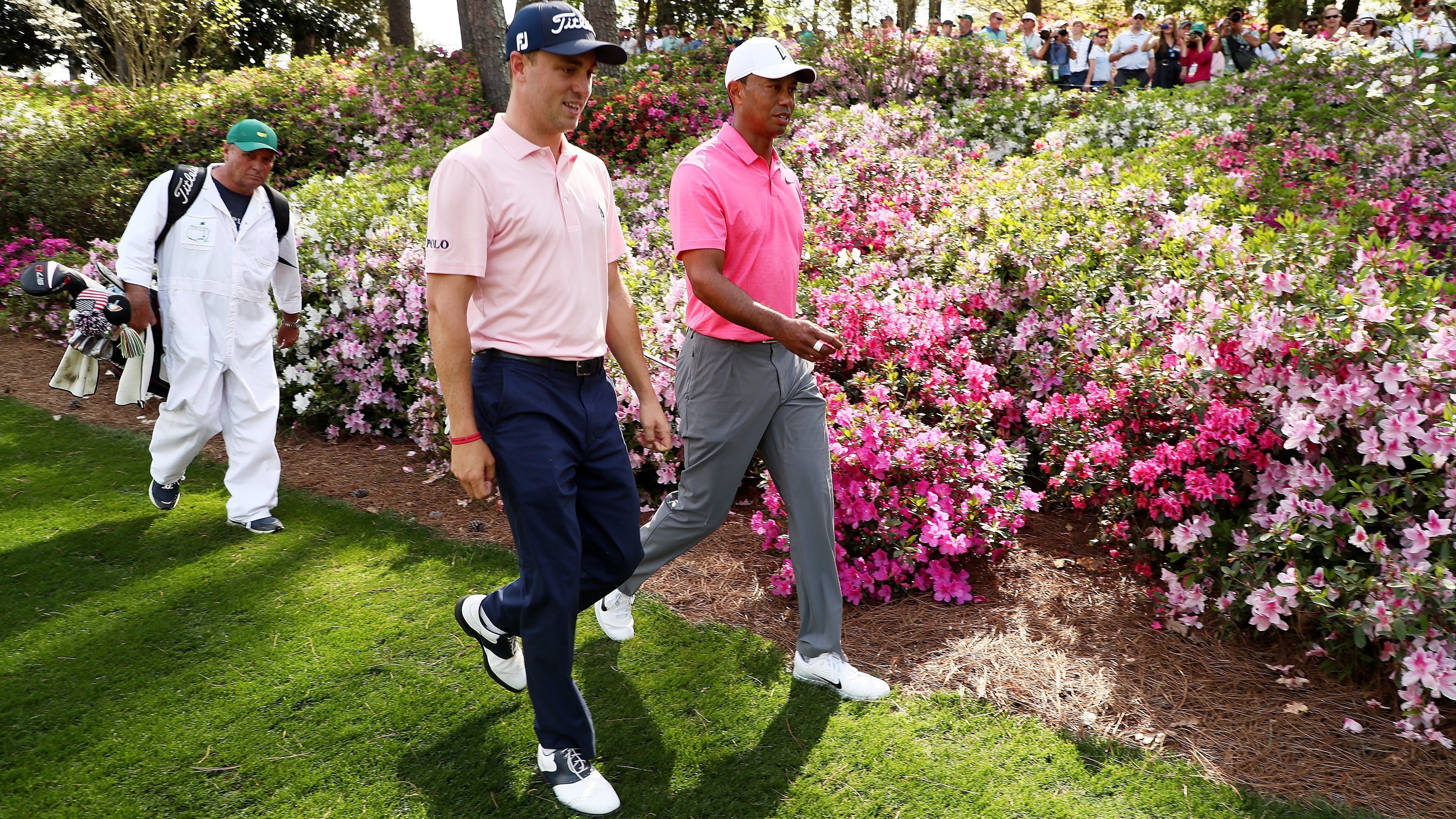 Justin Thomas amd Tiger Woods of the United States walk on the seventh hole during a practice round prior to the start of the 2018 Masters Tournament at Augusta National Golf Club on April 2, 2018 in Augusta, Georgia. (Photo by Jamie Squire/Getty Images)