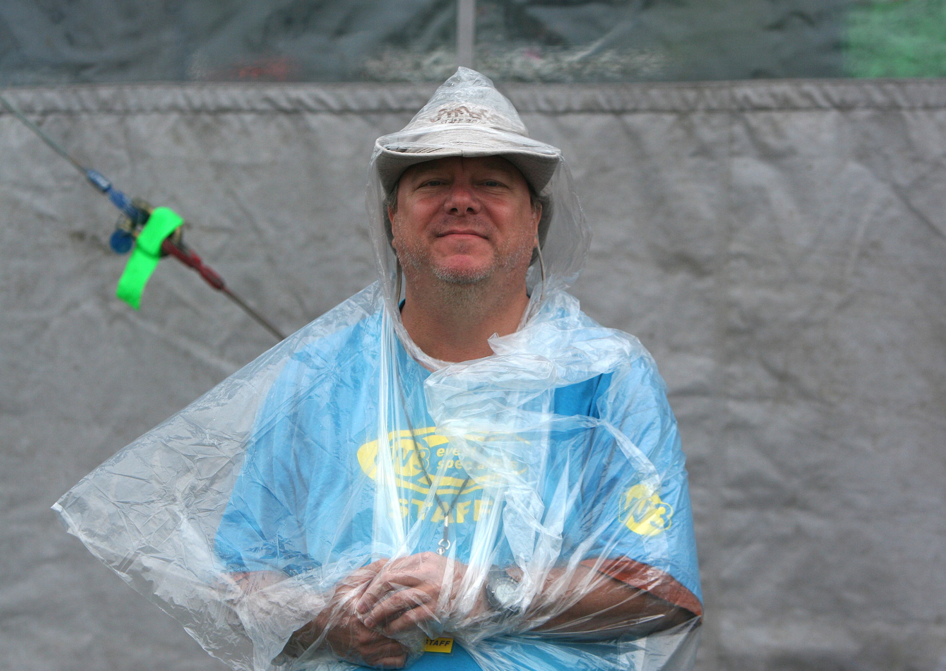 Staffer Pablo Dummer tries to stay dry at Austin City Limits Music Festival, 10.11.14 MARCIAL GUAJARDO/ROUND ROCK LEADER