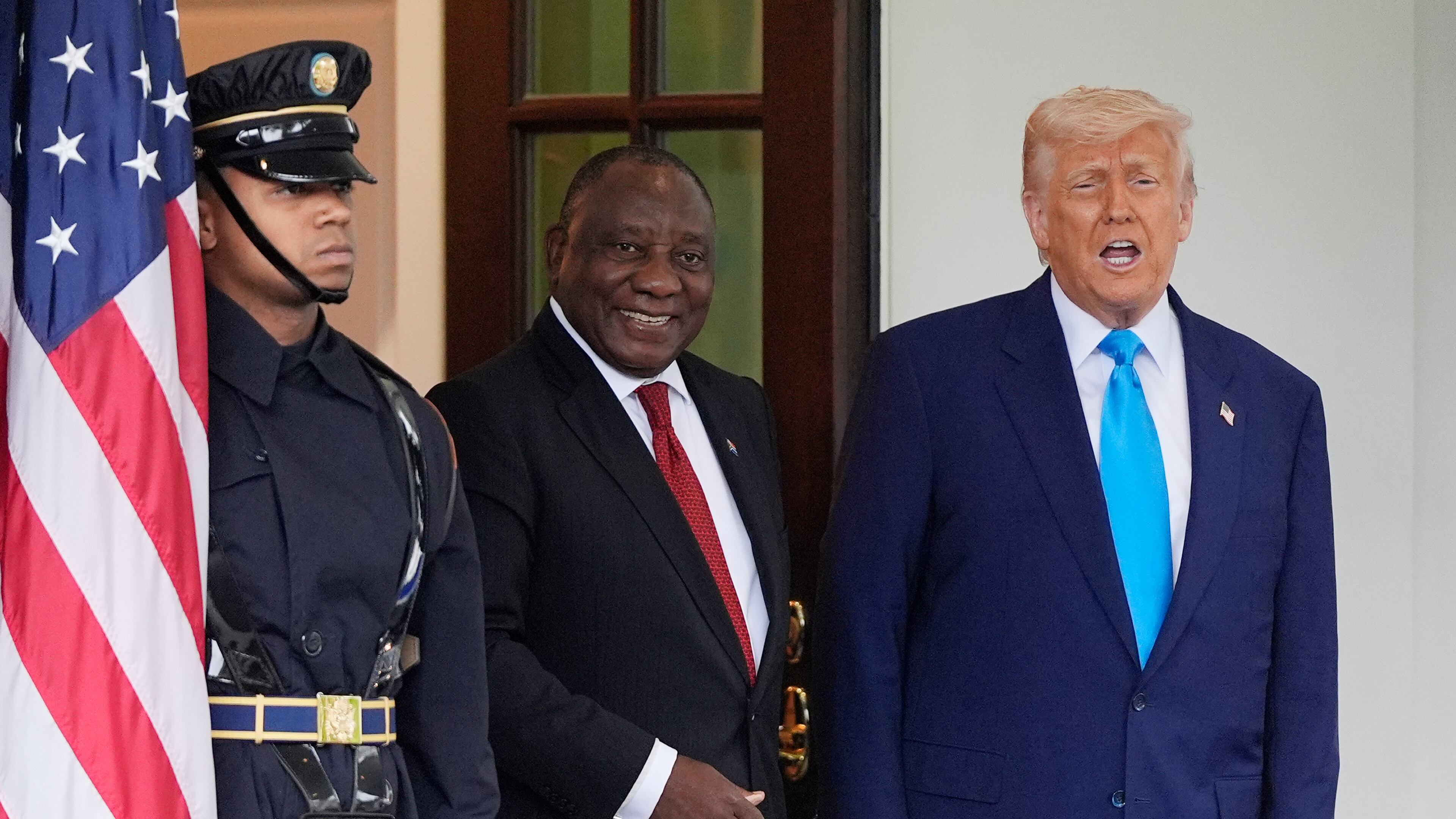 FILE - President Donald Trump greets South African President Cyril Ramaphosa, center, at the White House, May 21, 2025, in Washington. (AP Photo/Julia Demaree Nikhinson, File)