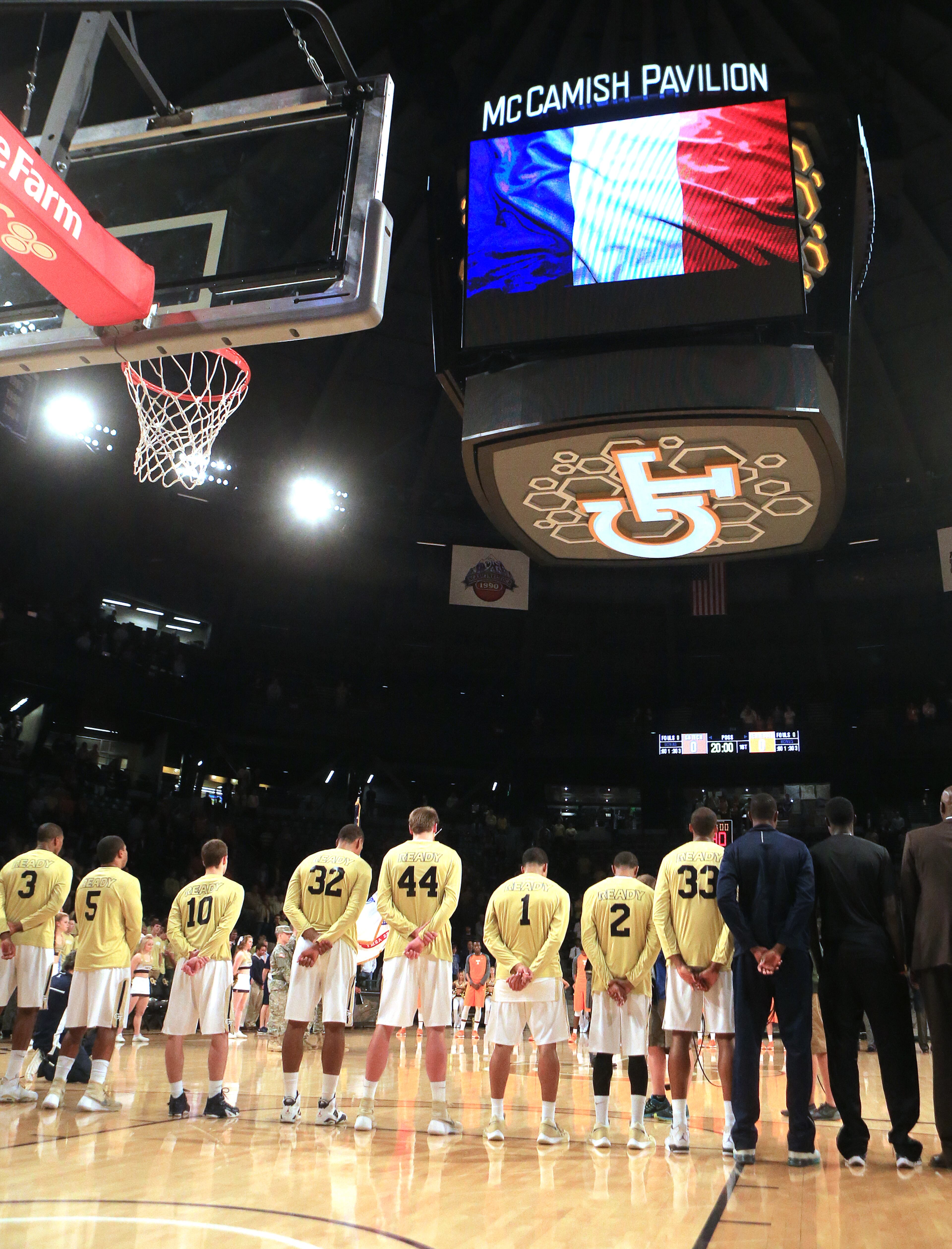 The Georgia Tech basketball team observes a moment of silence for the people of France before tipoff against Tennessee during the first half in a basketball game on Monday, Nov. 16, 2015 in Atlanta. Curtis Compton / ccompton@ajc.com