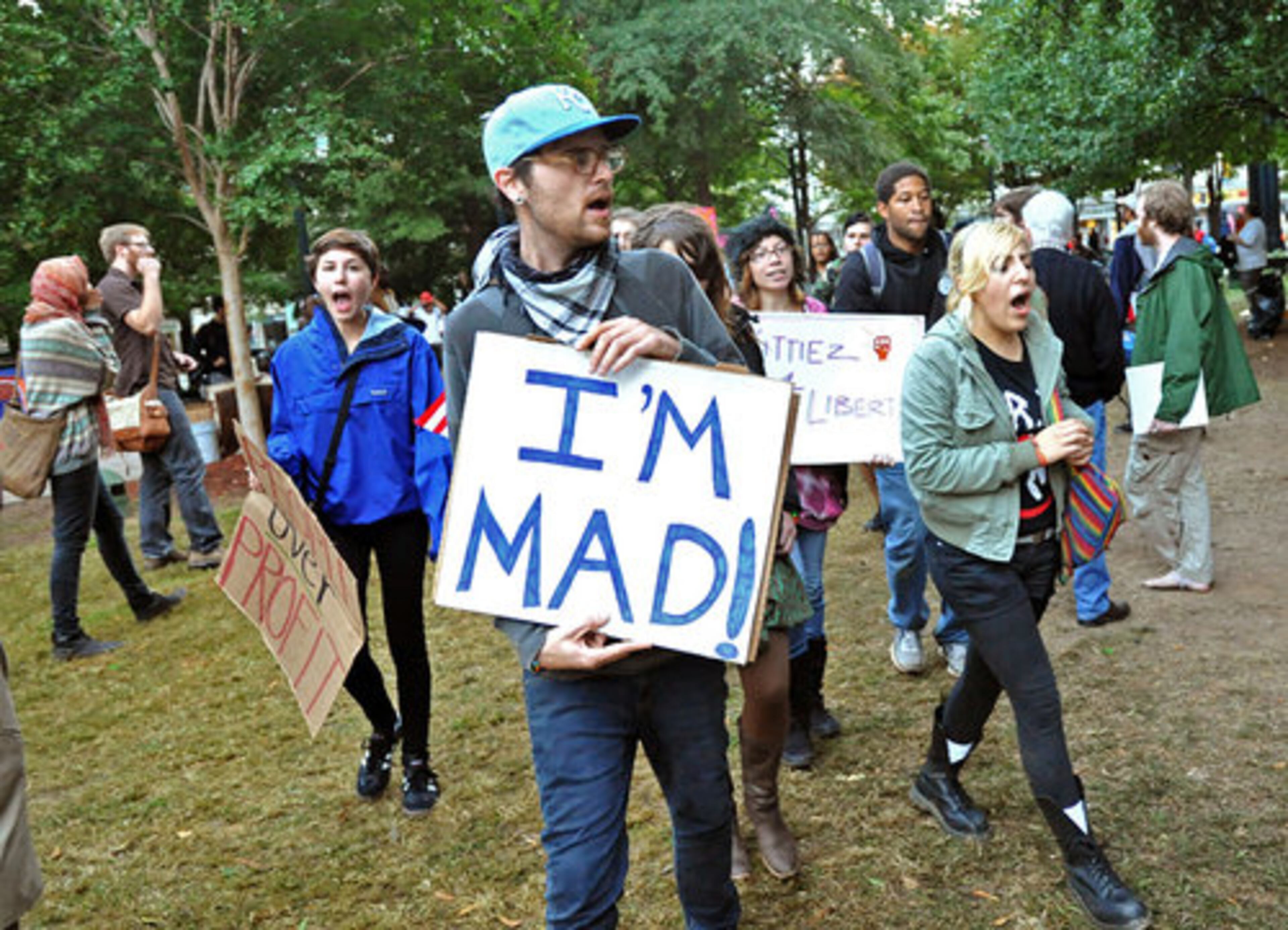 Occupy Atlanta protesters march in Woodruff Park on Thursday evening, Oct. 13, 2011.