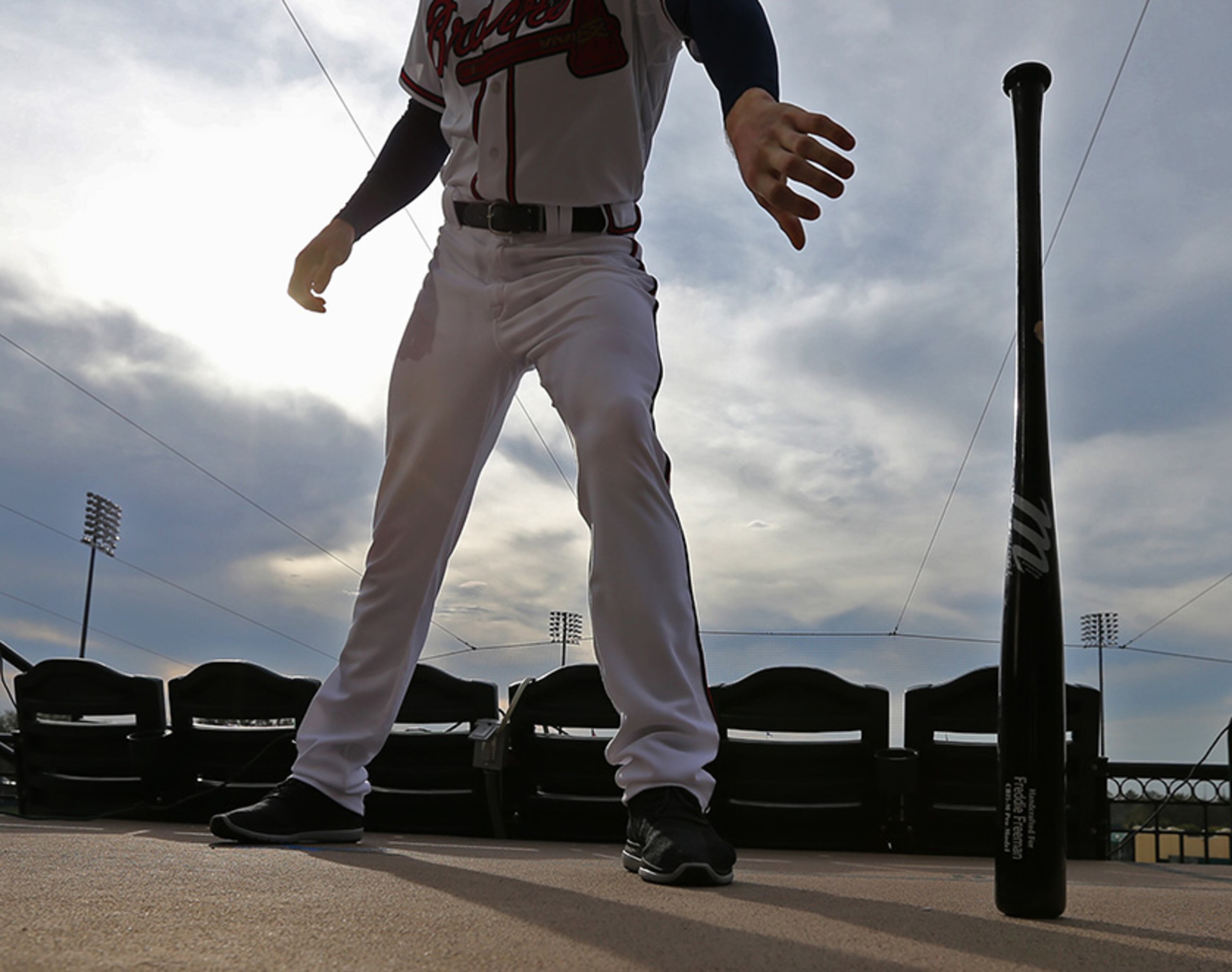 February 21, 2017, Lake Buena Vista, FL: Atlanta Braves first baseman Freddie Freeman reachers for his bat during photo day at spring training in Champion Stadium on Tuesday Feb. 21, 2017, at the ESPN Wide World of Sports in Lake Buena Vista. Curtis Compton/ccompton@ajc.com