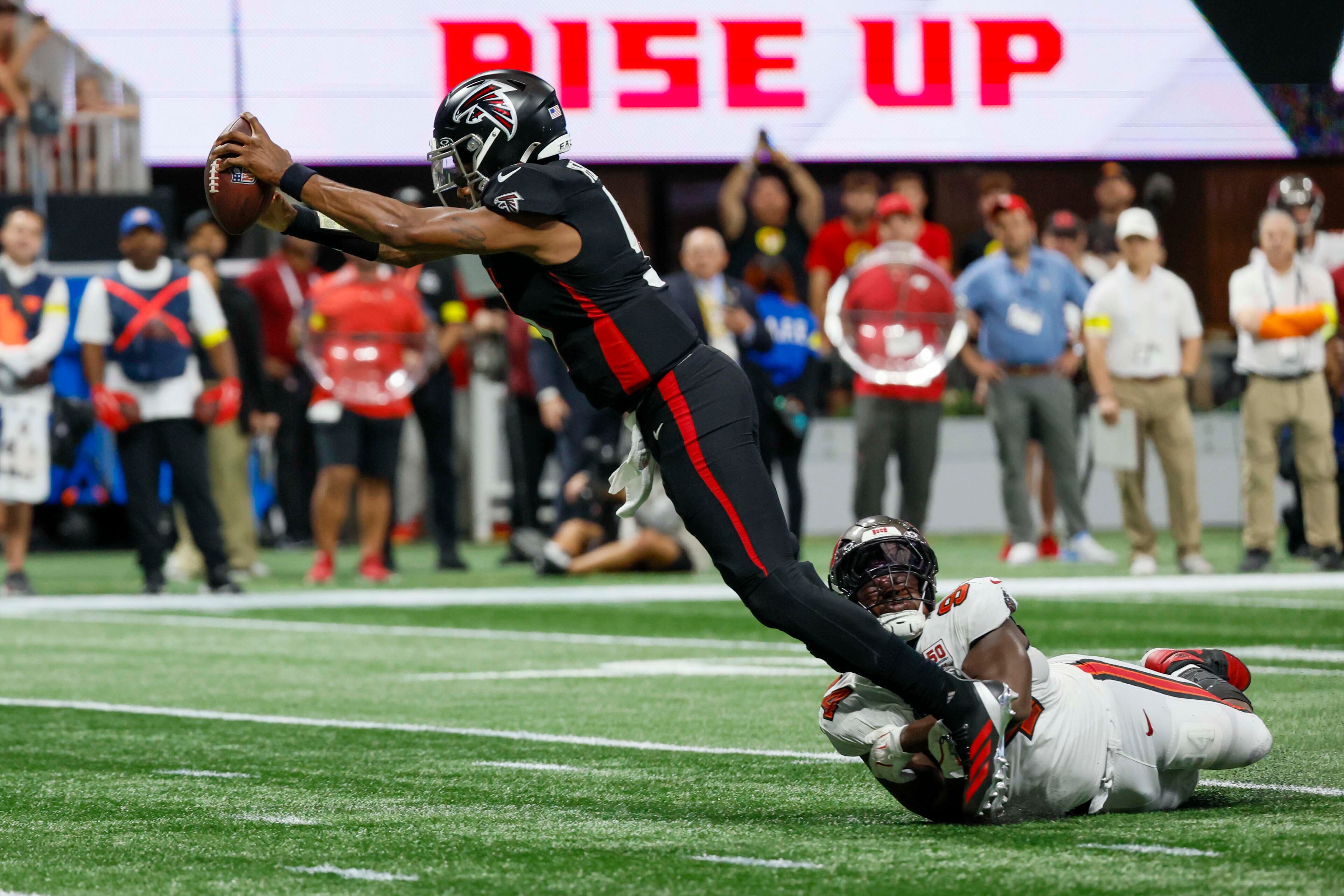 Atlanta Falcons quarterback Michael Penix Jr. (9) dives into the end zone as he scores a touchdown during the second half of an NFL game against the Tampa Bay Buccaneers at Mercedes-Benz Stadium on Sunday, September 7, 2025, in Atlanta.
(Miguel Martinez/ AJC)