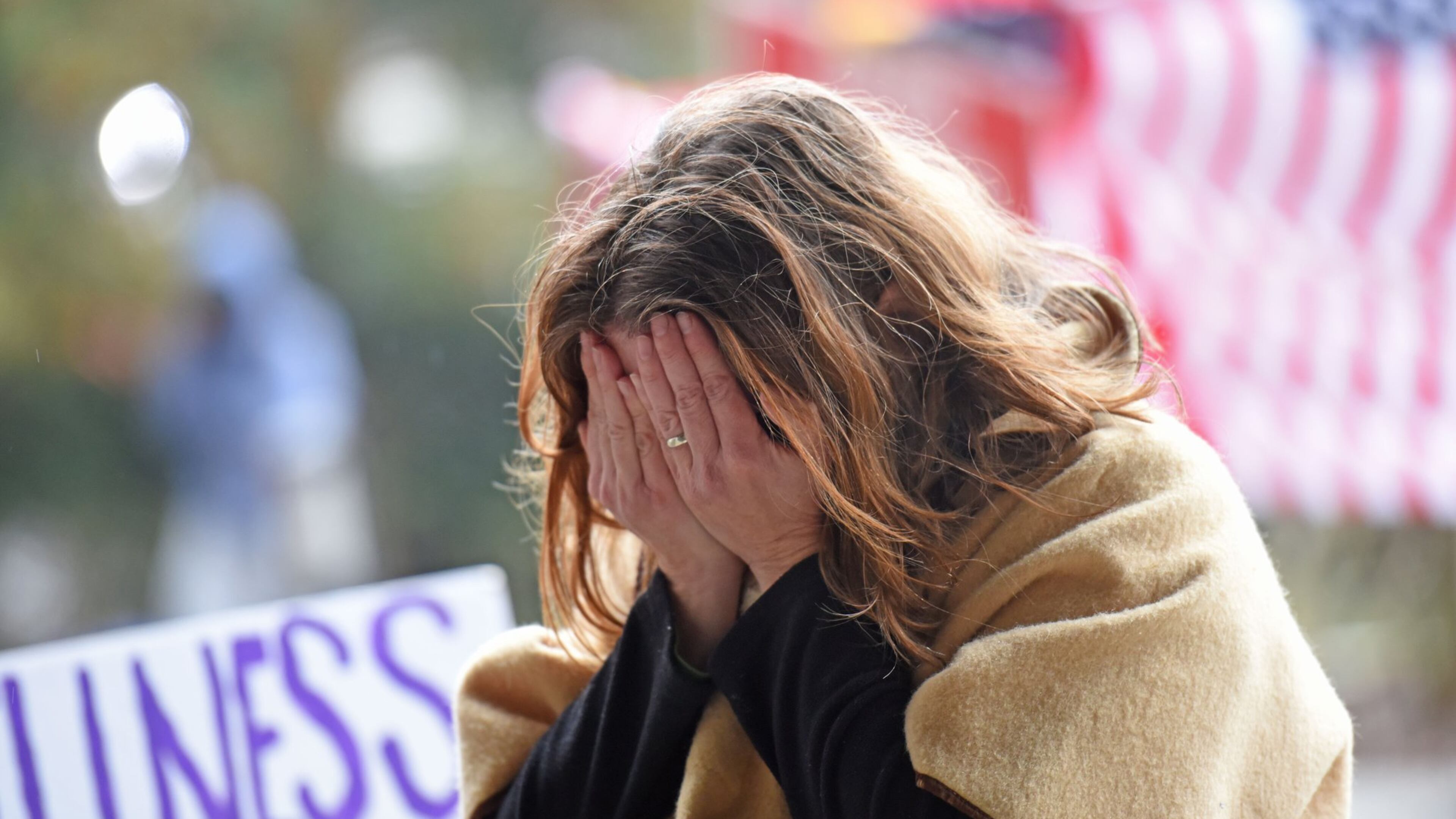 A protester gets emotional as she prays outside the DeKalb County courthouse on Thursday, while awaiting the grand jury’s decision on whether to charge a police officer in the shooting death of a civilian.