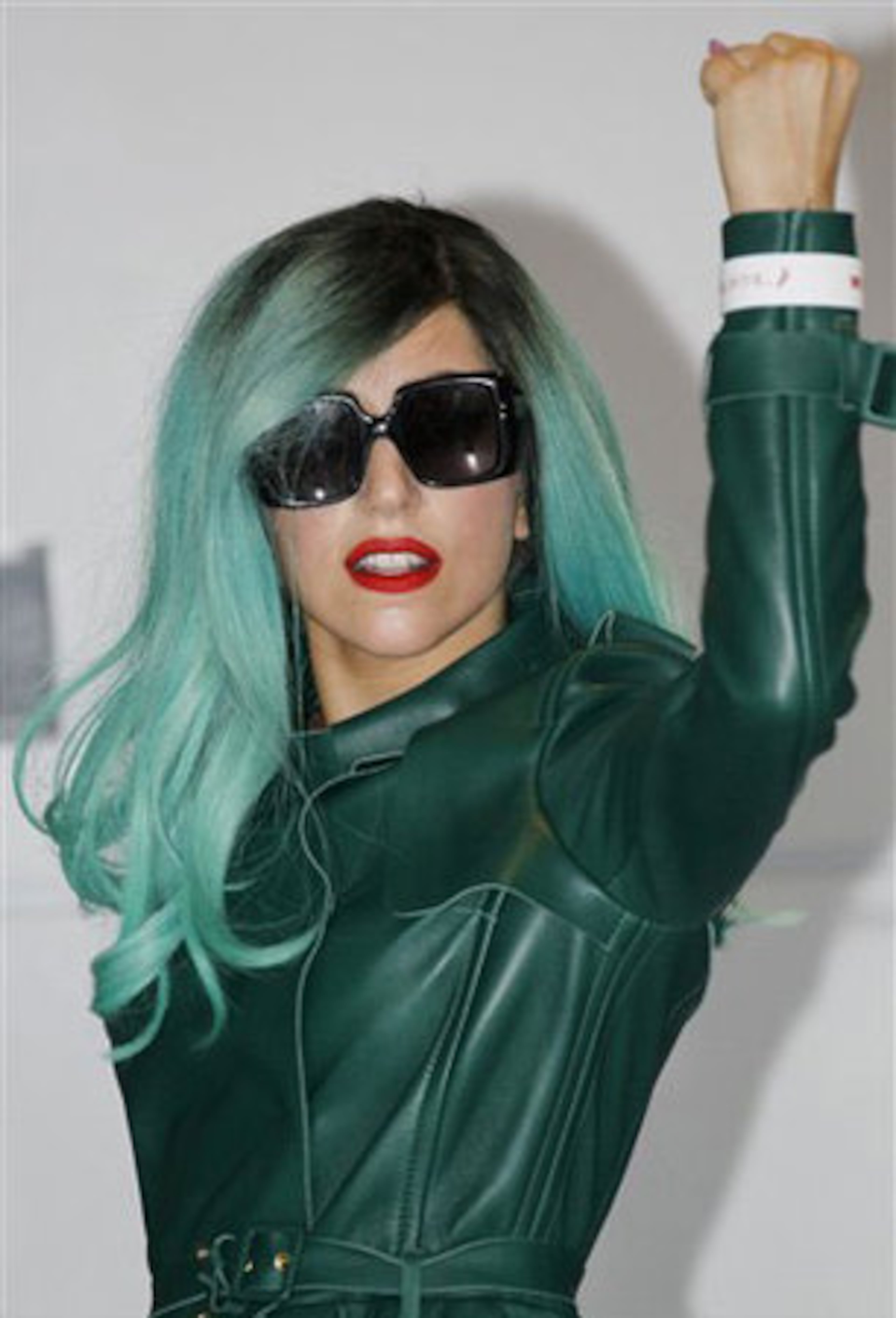 Teal power! If you aren't into the beehive, let your hair down, as long as it's painted teal. Then break out all of your teal attire to complete the look.