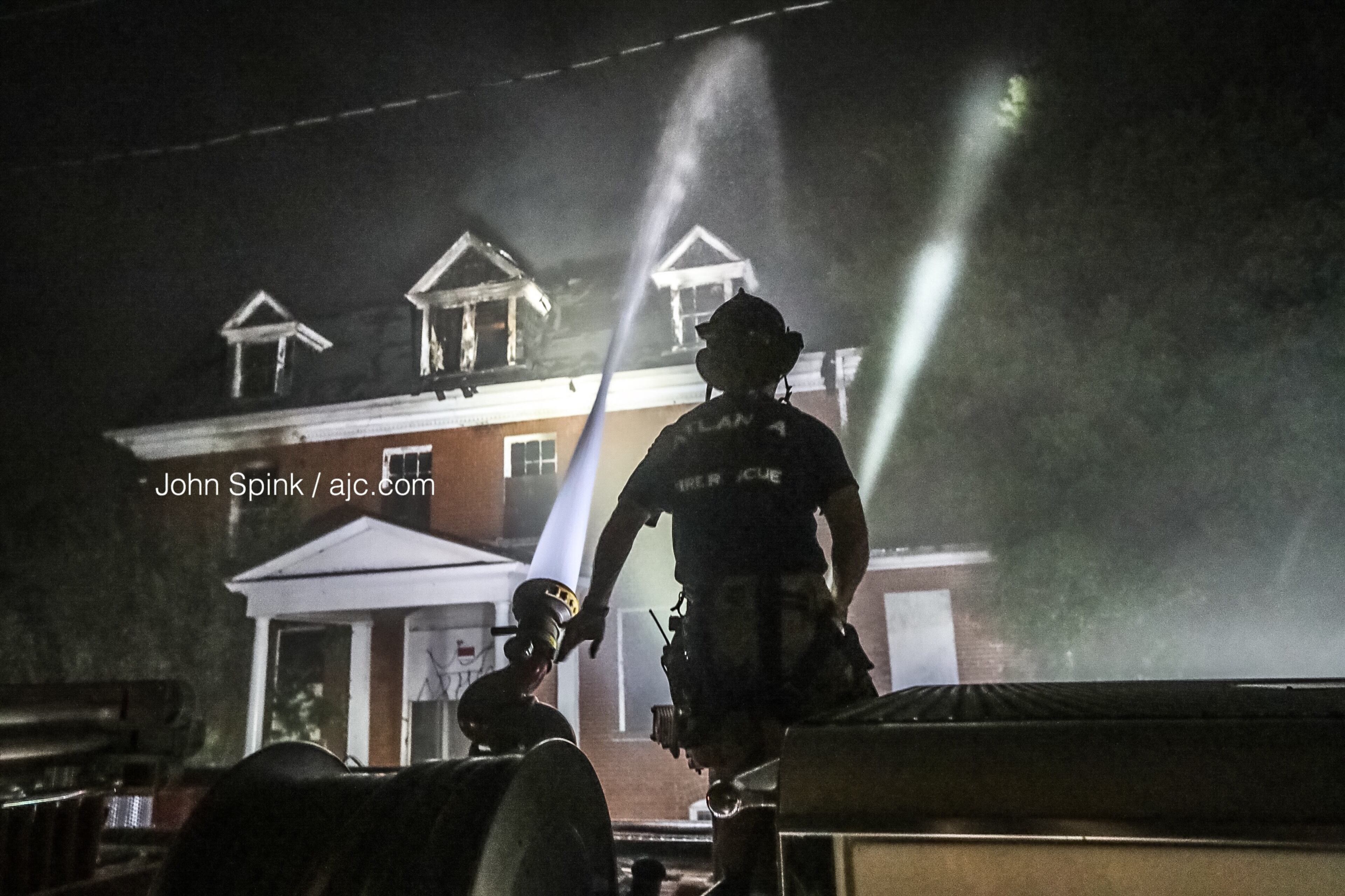 Firefighters continued to douse hot spots at the historic building Thursday morning.