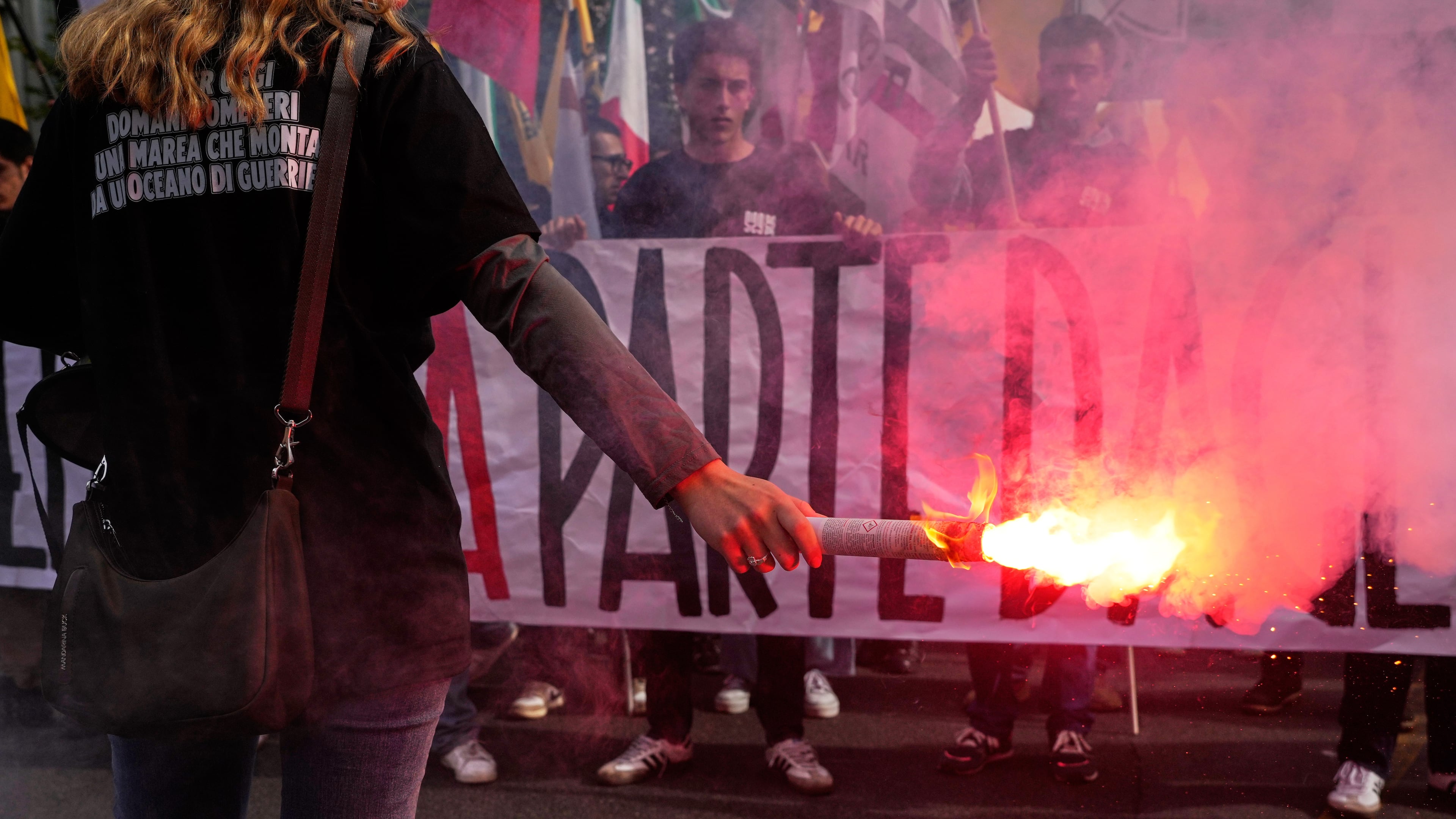 Members of right-wing student groups march through the streets of Rome, Saturday, Oct. 24, 2026, during a demonstration called "Unlock Everything," organized in opposition to recent left-wing student protests and one of several demonstrations held by groups across the political spectrum. (AP Photo/Gregorio Borgia)