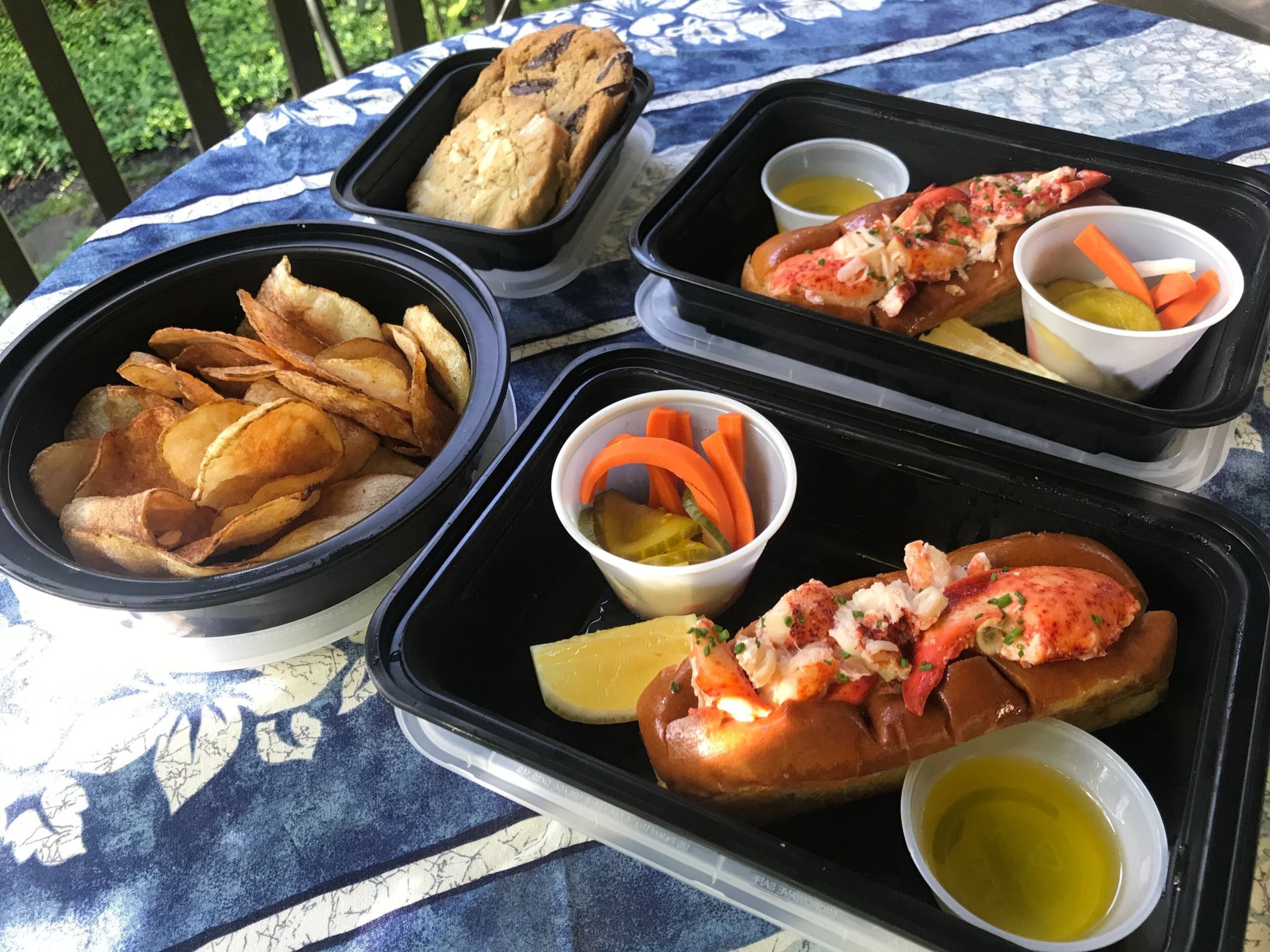The lobster roll party, available for two ($49) or four ($98), is Drift’s most popular takeout meal. The buttered, toasted rolls are amply filled with meaty chunks of fresh seafood. The dinner also comes with a generous serving of rich lobster bisque (not pictured), crab-flavored potato chips, house pickles and chewy chocolate chip cookies. LIGAYA FIGUERAS / LIGAYA.FIGUERAS@AJC.COM