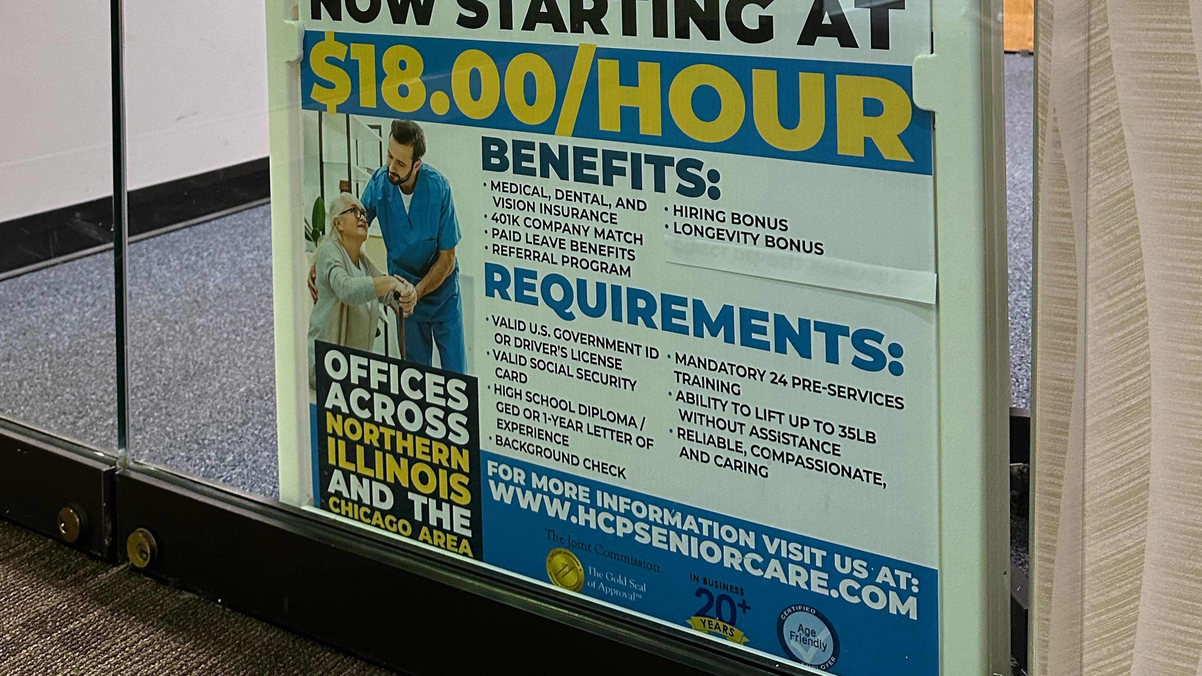 Hiring sign is displayed at a office in Schaumburg, Ill., Tuesday, Jan. 5, 2026. (AP Photo/Nam Y. Huh)