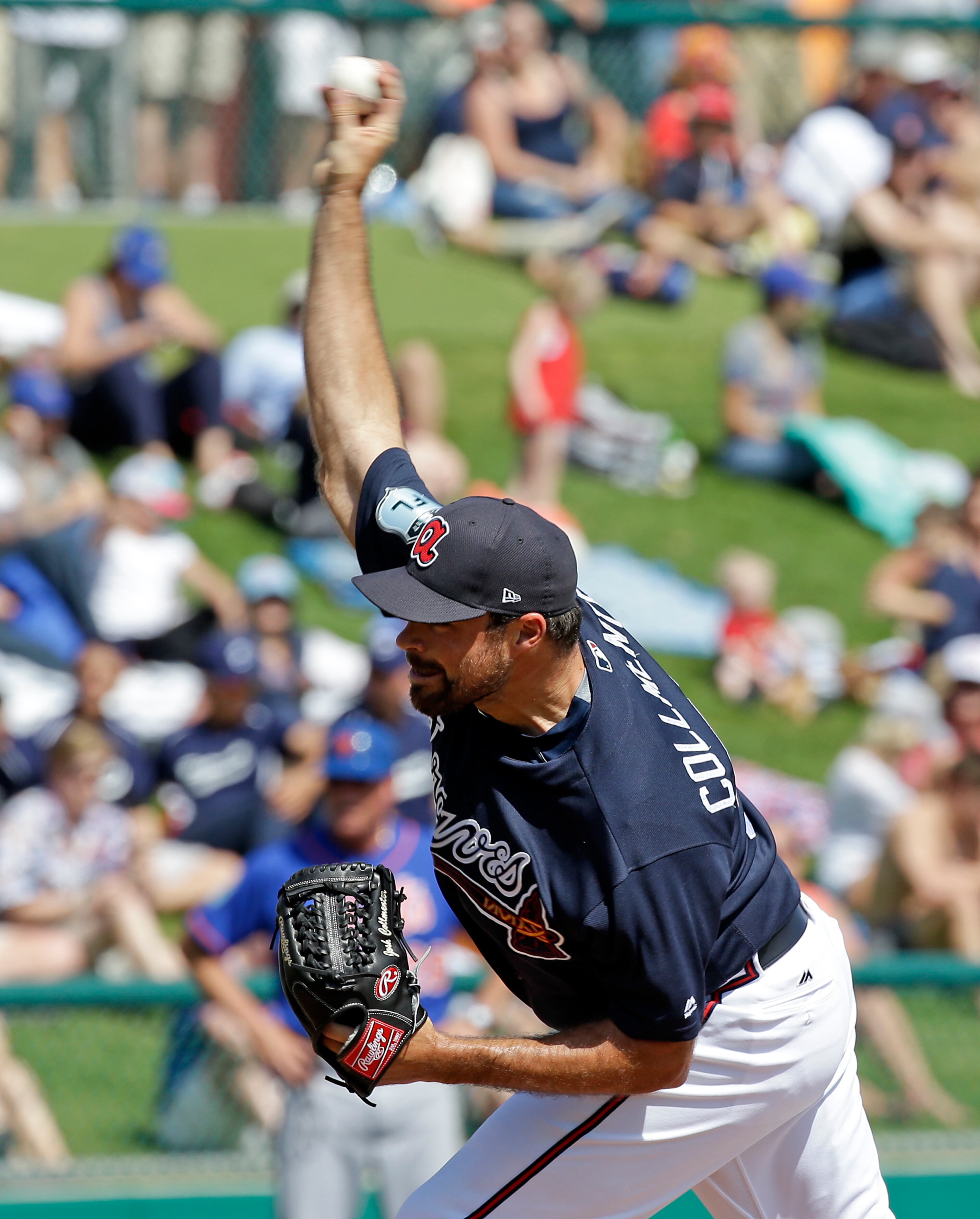 Atlanta Braves relief pitcher Josh Collmenter throws against the New York Mets in the fourth inning of a spring training baseball game, Friday, March 10, 2017, in Kissimmee, Fla. (AP Photo/John Raoux)