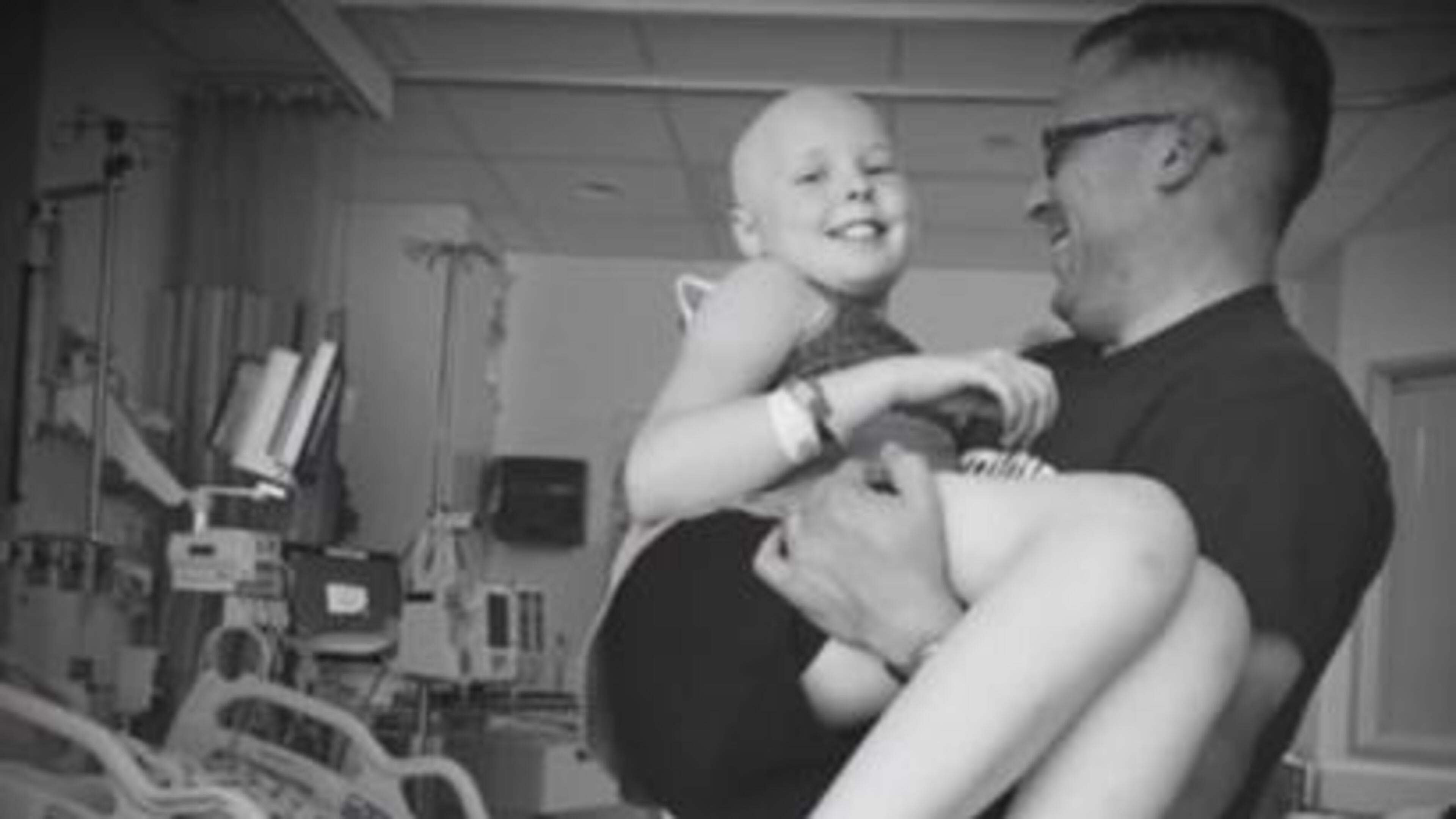 Mike Kendall holds his daughter, 12-year-old Maeve Kendall. Mike will be running in Monday's Boston Marathon.