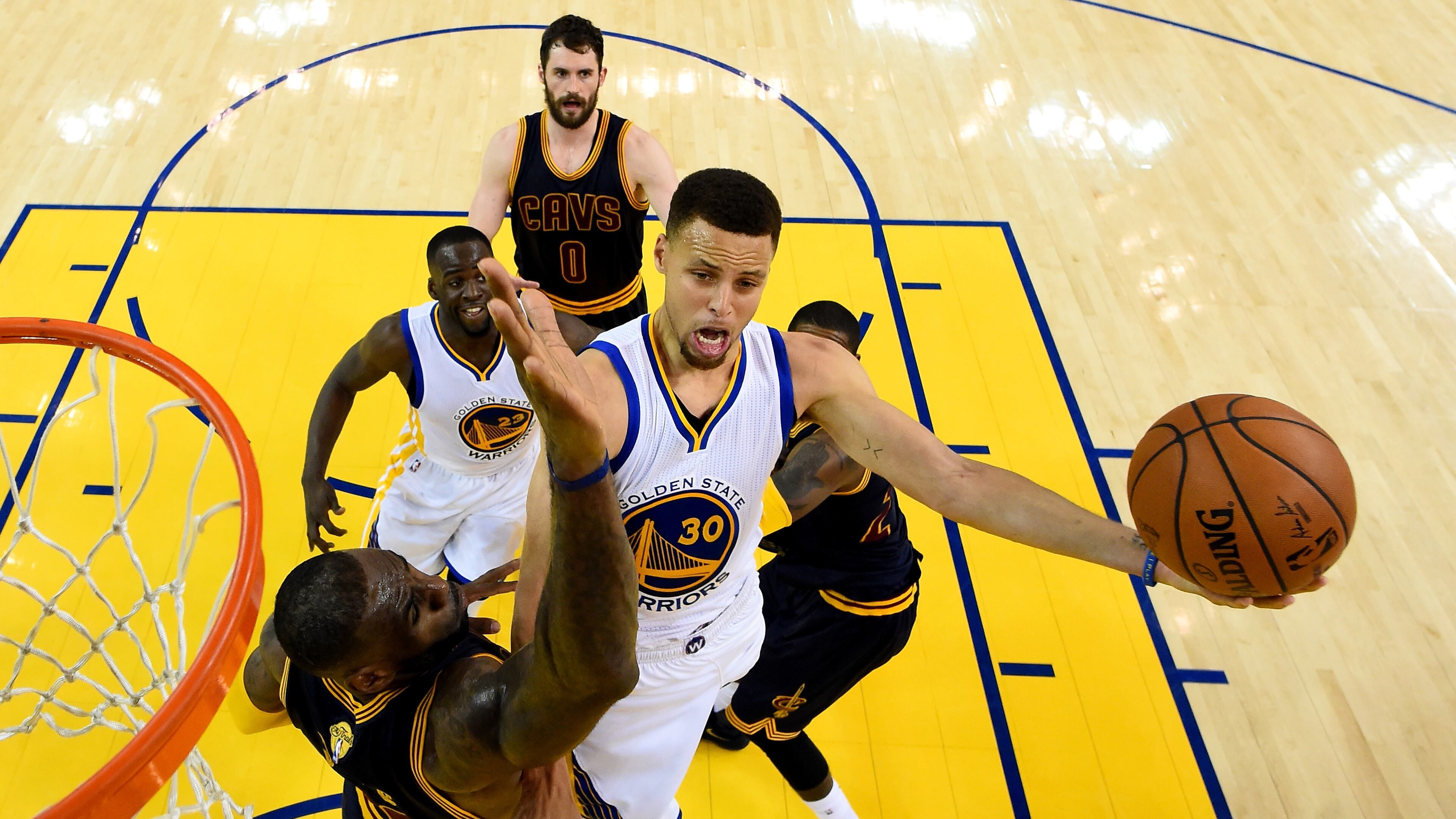 Stephen Curry (30) of Golden State goes up for a shot against LeBron James of Cleveland in the first half of Sunday’s Game 2 of the NBA Finals. (Photo by Bob Donnan/Getty Images)