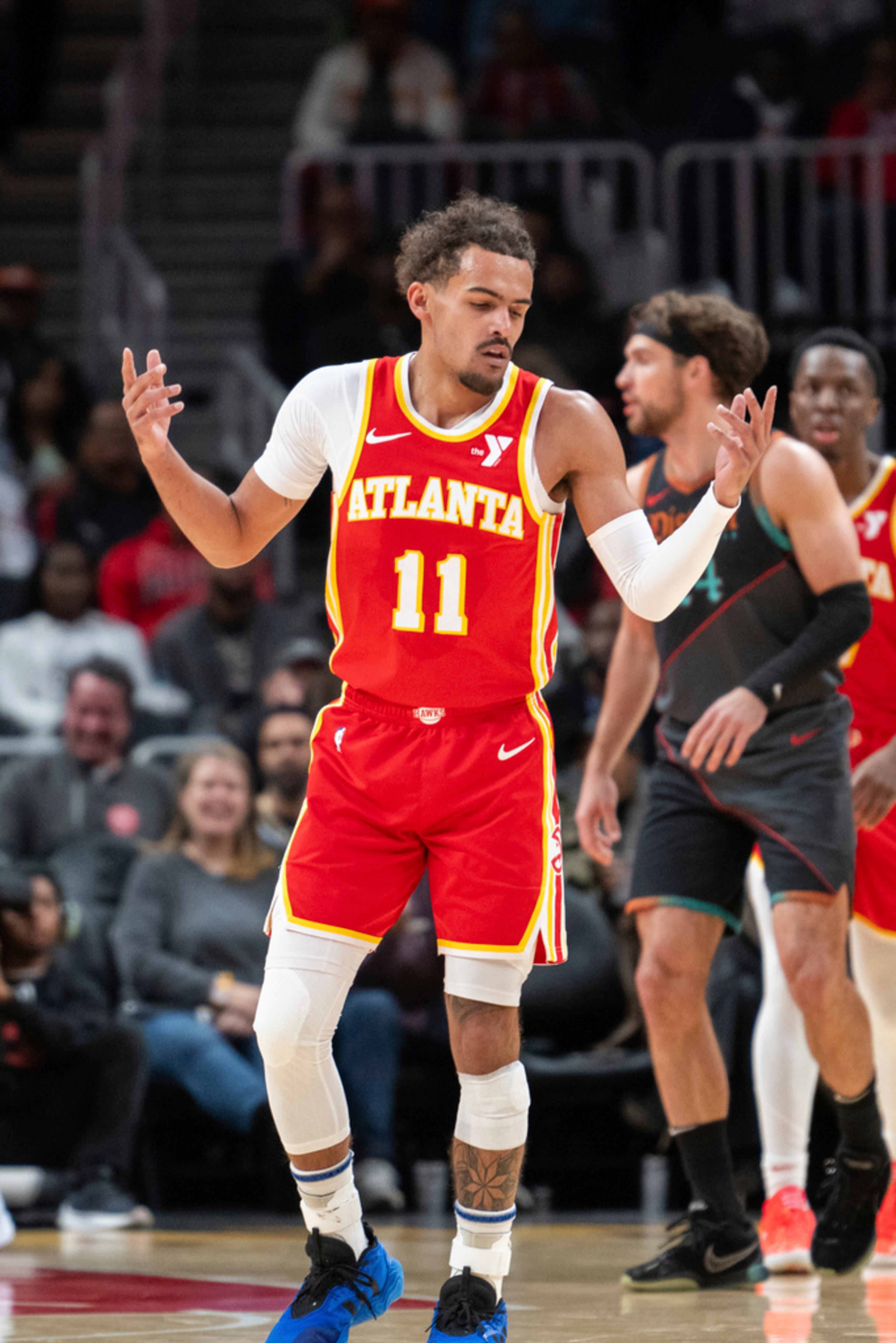 Atlanta Hawks guard Trae Young (11) reacts after making a 3-point basket during the first half of an NBA basketball game against the Washington Wizards, Saturday, Jan 13, 2024, in Atlanta. (AP Photo/Hakim Wright Sr.)