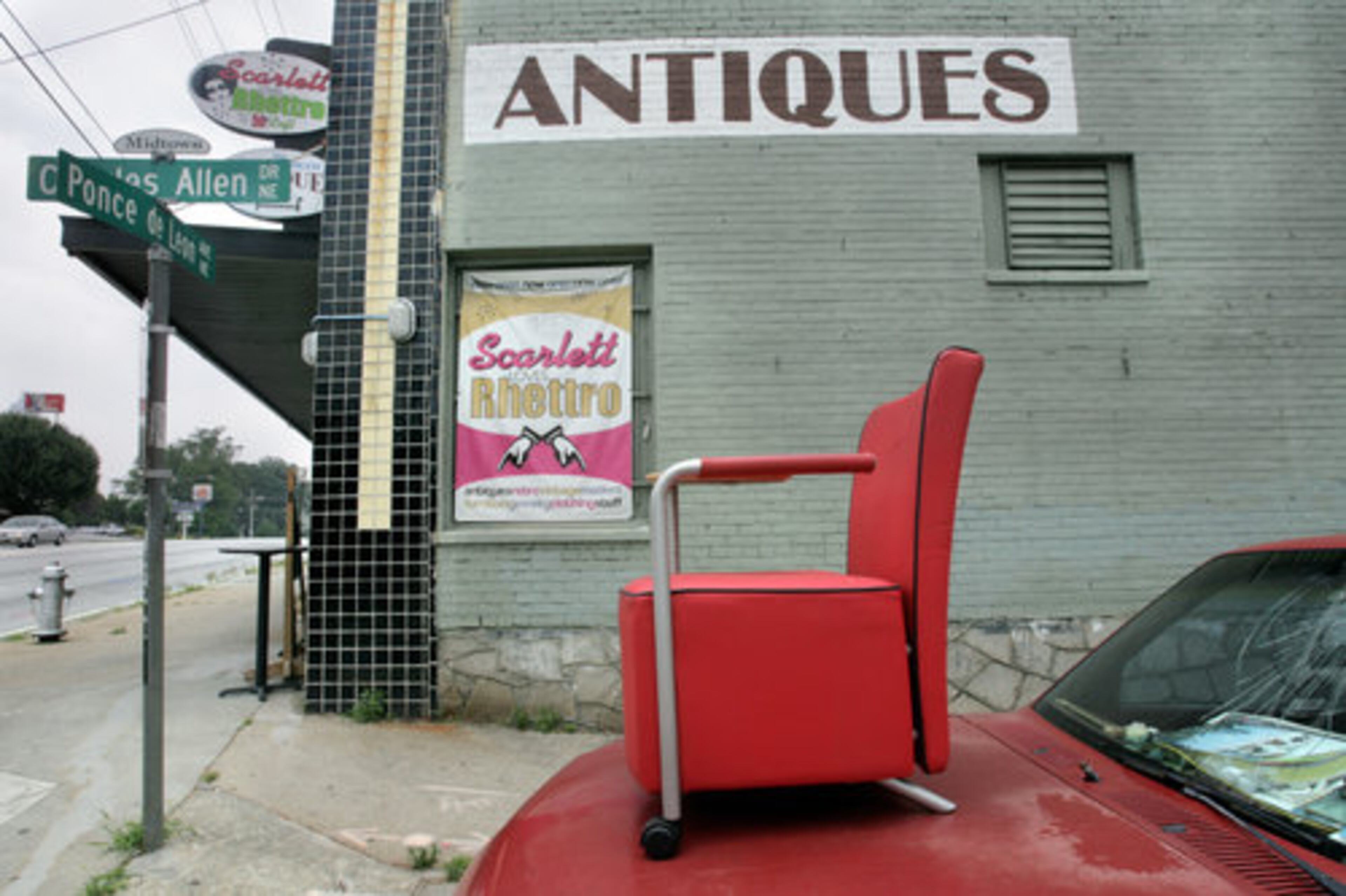 Midtown: Scarlett Loves Rhettro antiques store in Midtown showcases a red chair.