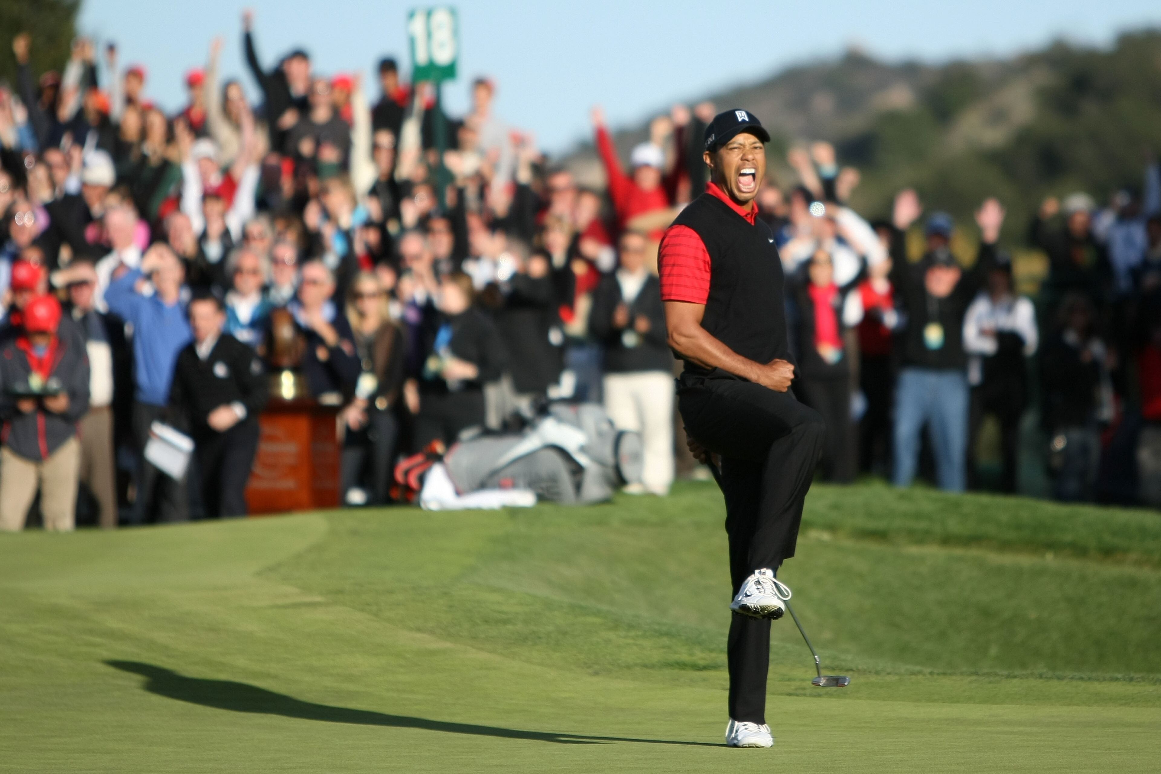 Tiger Woods celebrates after his birdie putt on the 18th hole to win the Chevron World Challenge at Sherwood Country Club on Dec. 4, 2011, in Thousand Oaks, Calif.